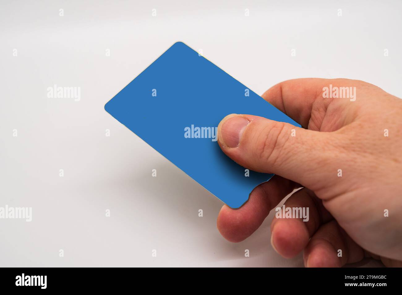Hand Holding a blank credit or debit card, A person making a payment concept isolated on white background Stock Photo