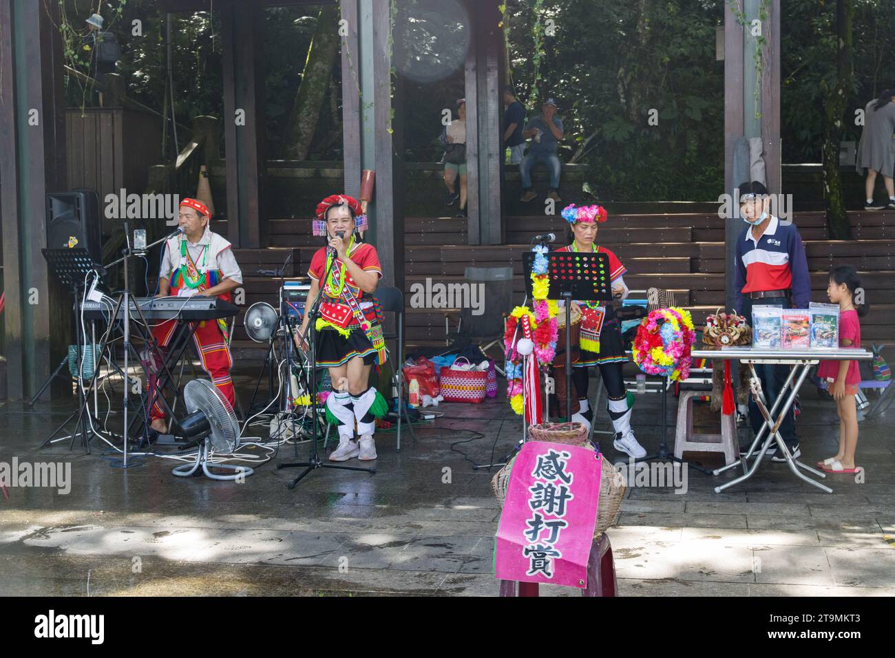 Sun Moon Lake,  Yuchi,  Taiwan - October 9, 2023: Taiwanese indigenous Thao Street Singers and Bands performing in Xuanguang Temple with traditional d Stock Photo