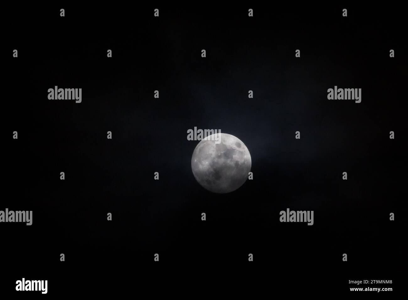 Full moon covered with clouds in the winter, Waldviertel, Austria Stock Photo