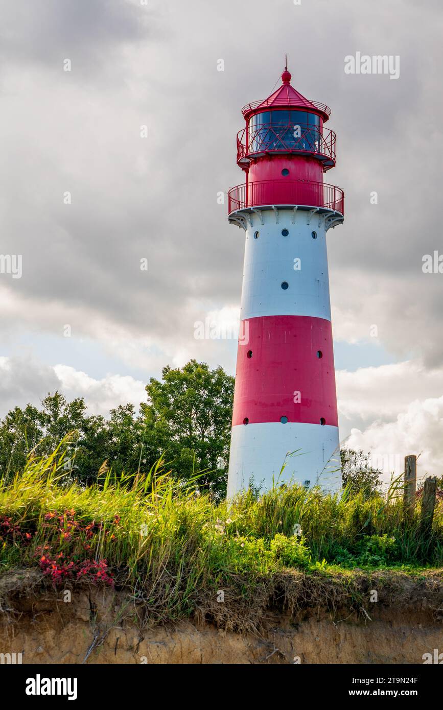 Lighthouse on the Baltic Sea with an overcast sky. Stock Photo