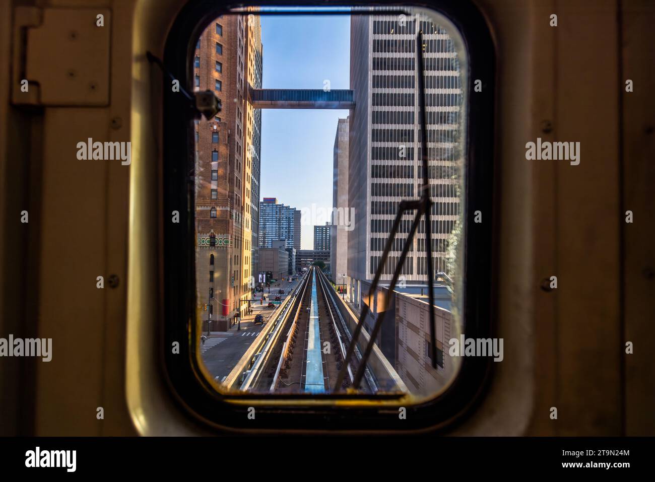 View from the Detroit People Mover. It is a 4.7-kilometer-long, automatically operated elevated railway system through downtown Detroit. Passengers on the circular line are tourists and workers from the stores and offices in the city center. The ride costs a quarter of a dollar and offers an interesting view of downtown Detroit. View through the front window of the driverless public transportation system. The elevated people mover winds its way through the city center of Detroit, United States Stock Photo