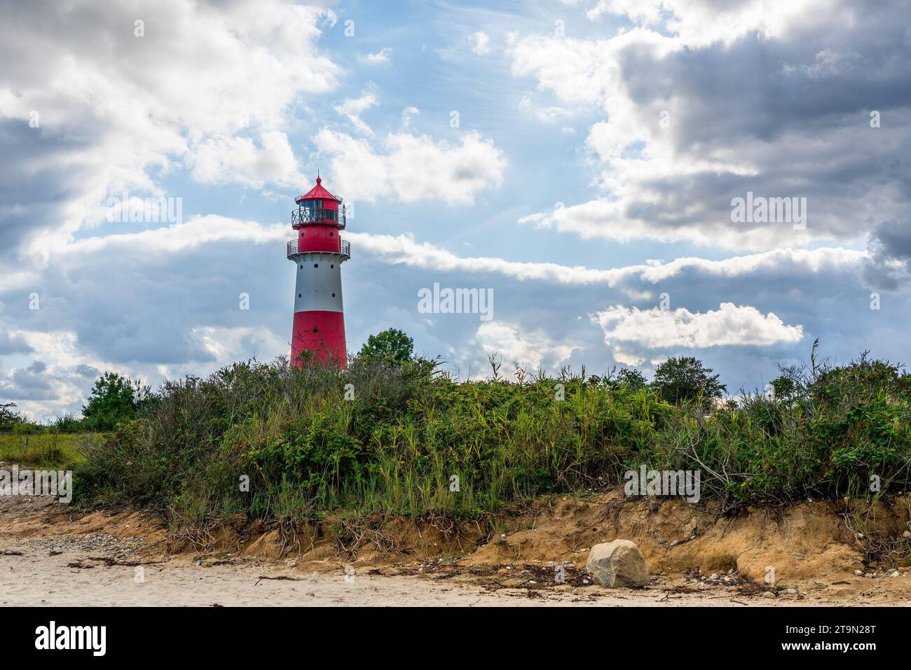 Lighthouse on the Baltic Sea with an overcast sky. Stock Photo