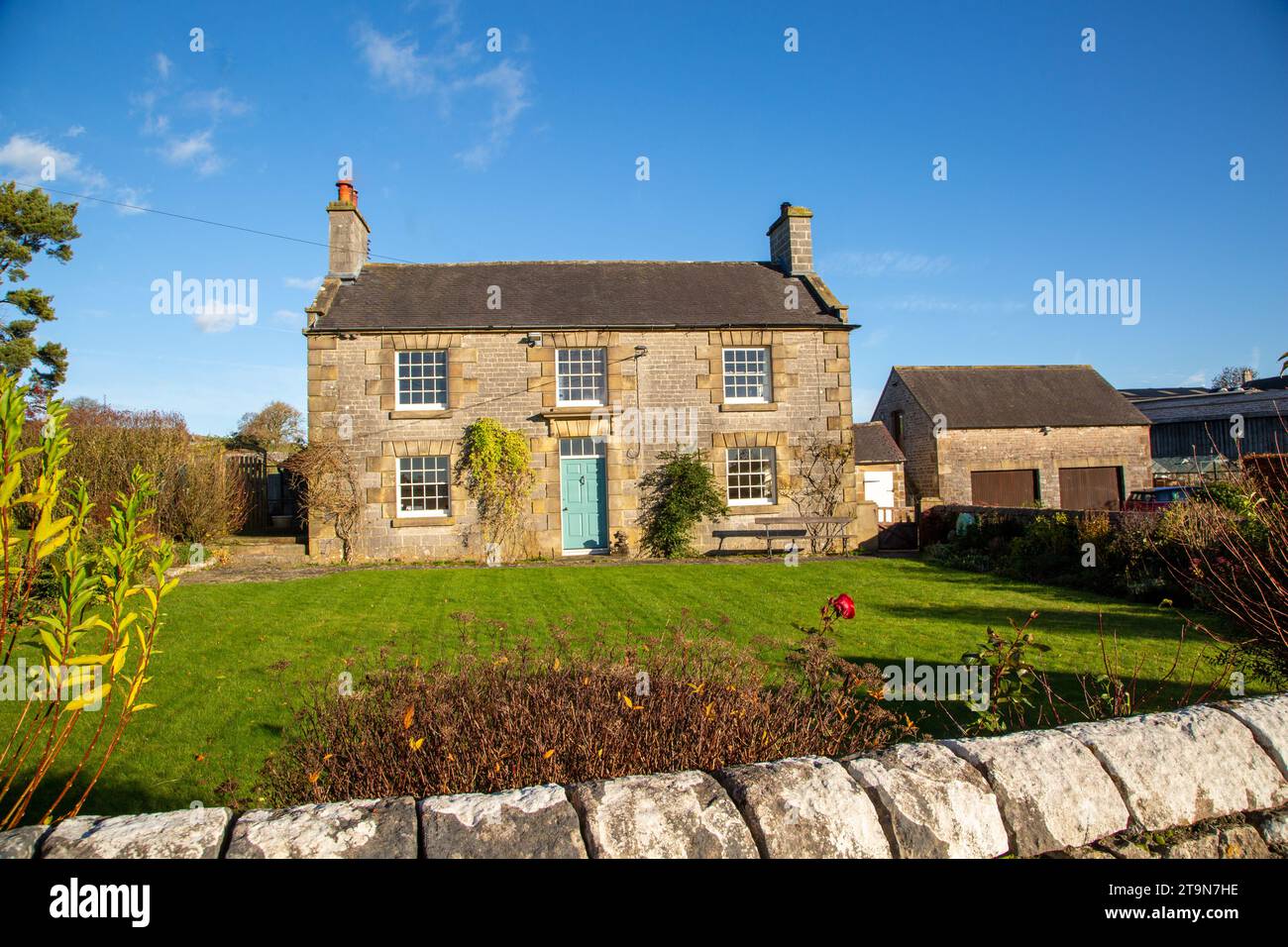 Farmhouse style country cottage in the Staffordshire Moorlands  Peak District village of Alstonefield England UK during winter Stock Photo