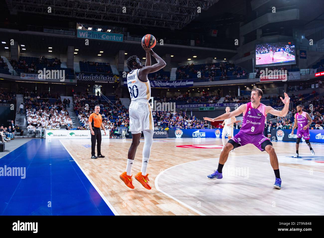 Madrid, Spain. 26th Nov, 2023. Eli Ndiaye (L) of Real Madrid and Nacho Llovet (R) of Morabanc Andorra seen in action during the Liga Endesa match between Real Madrid and Morabanc Andorra at Wizink Center. Final score; Real Madrid 85:76 Morabanc Andorra. Credit: SOPA Images Limited/Alamy Live News Stock Photo