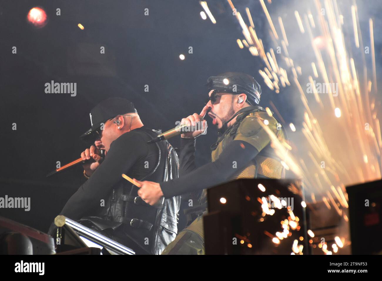 Mexico City, Mexico. 25th Nov, 2023. Juan Luis Morera, known as Wisin, and Llandel Veguilla, known as Yandel, members of the Puerto Rican Reggaeton duo Wisin & Yandel, are performing on stage as part of the 'Coca Cola Flow Fest 2023' Reggaeton music festival at Autodromo Hermanos Rodriguez in Mexico City, Mexico, on November 25, 2023. (Photo by Essene Hernandez/Eyepix Group) Credit: NurPhoto SRL/Alamy Live News Stock Photo