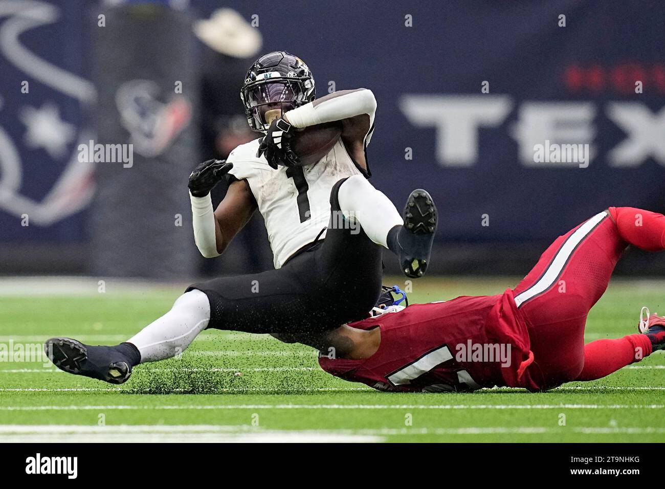 Houston Texans safety Jimmie Ward (1) is stopped on a carry by Houston ...