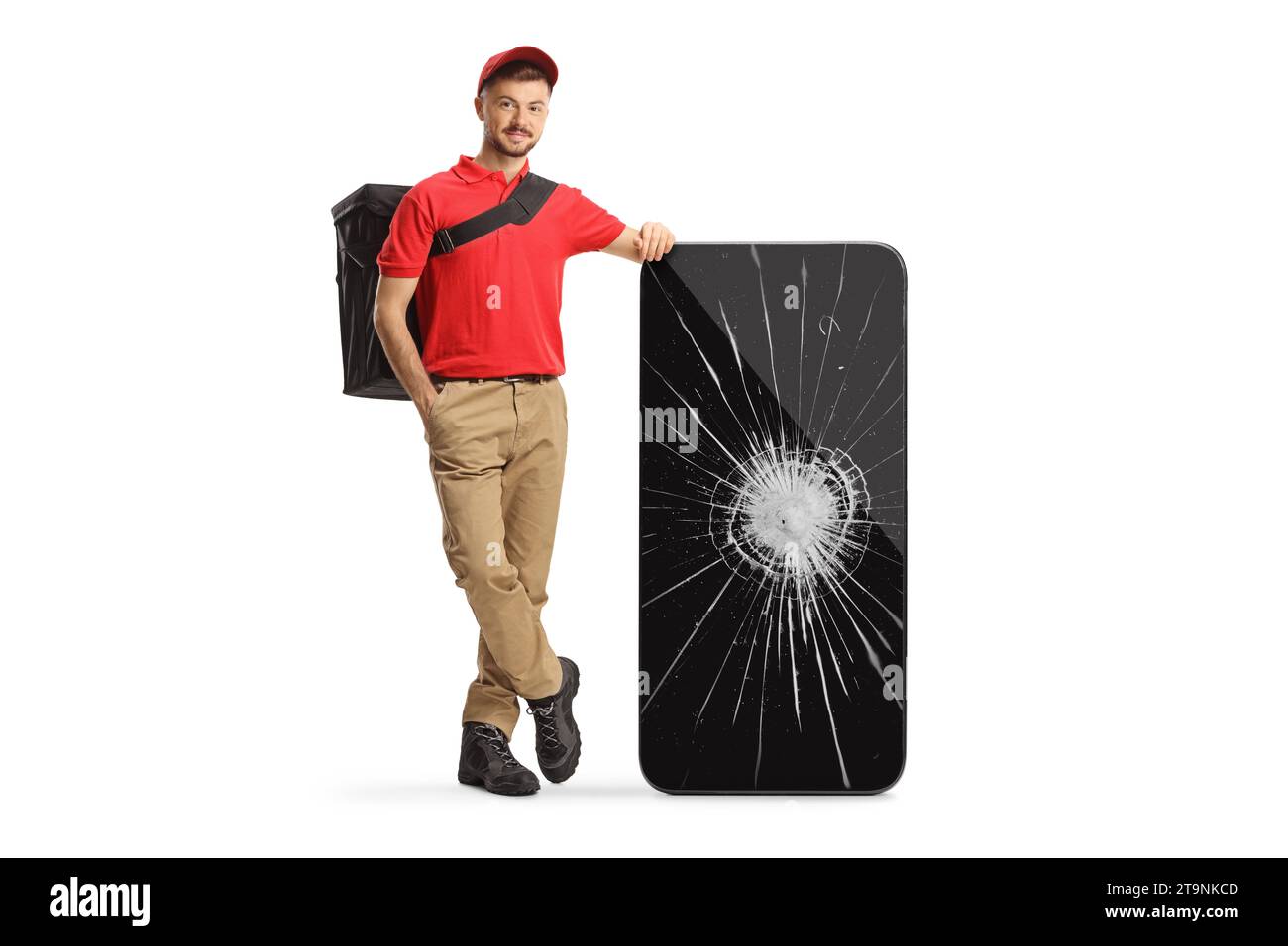 Delivery man leaning on a smartphone with a broken screen isolated on white background Stock Photo