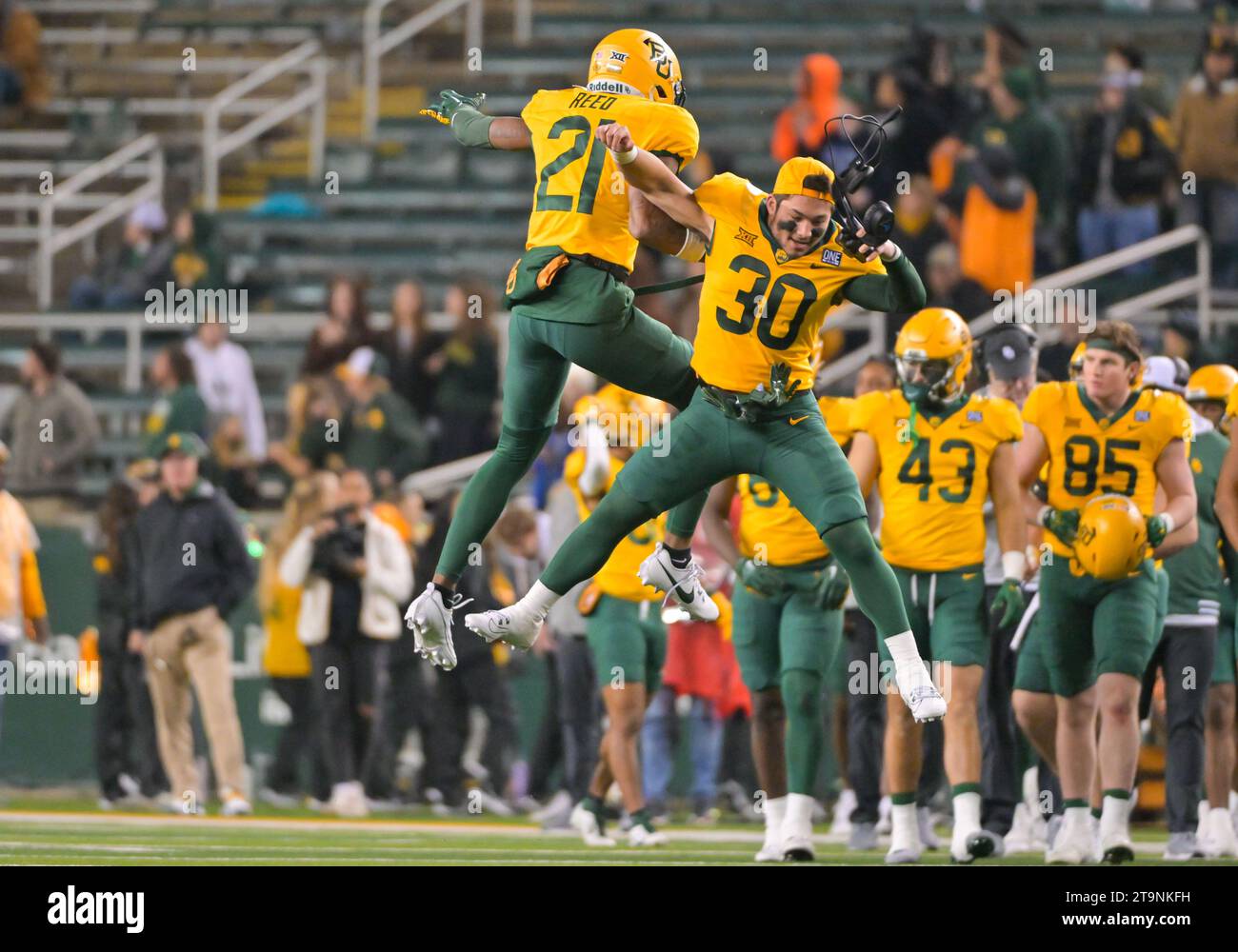 Waco, Texas, USA. 25th Nov, 2023. Baylor Bears cornerback Chateau Reed (21) and Baylor Bears safety Michael Allen (30) celebrate a defensive stop during the 2nd half the NCAA Football game between the West Virginia Mountaineers and Baylor Bears at McLane Stadium in Waco, Texas. Matthew Lynch/CSM/Alamy Live News Stock Photo