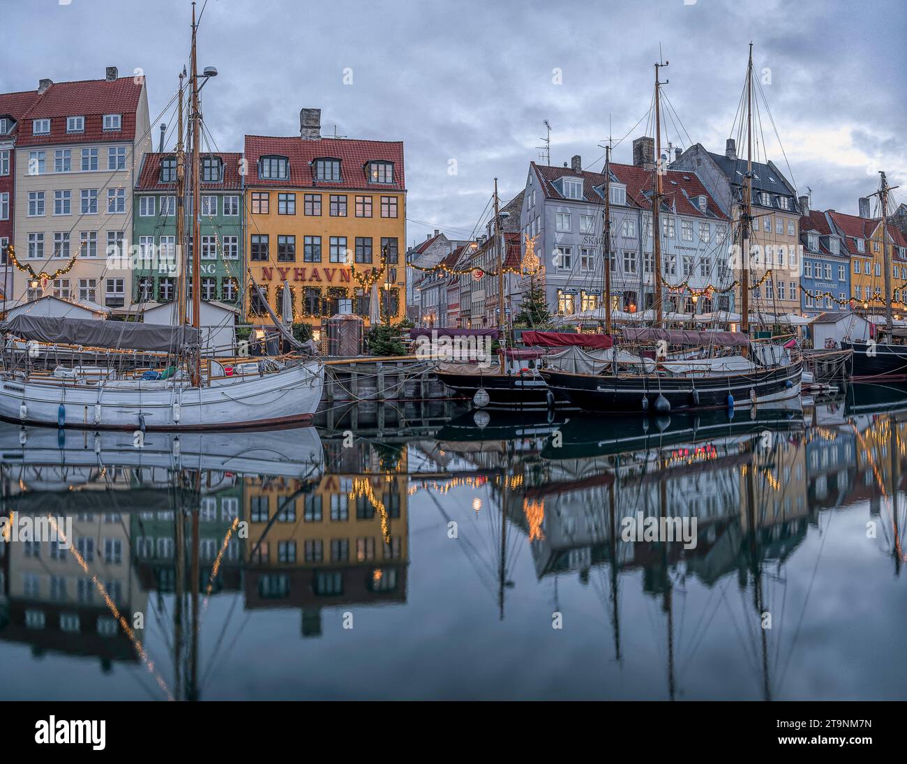 Denmark In November christmas decorations at the Nyhavn canal in Copenhagen in the blue ...