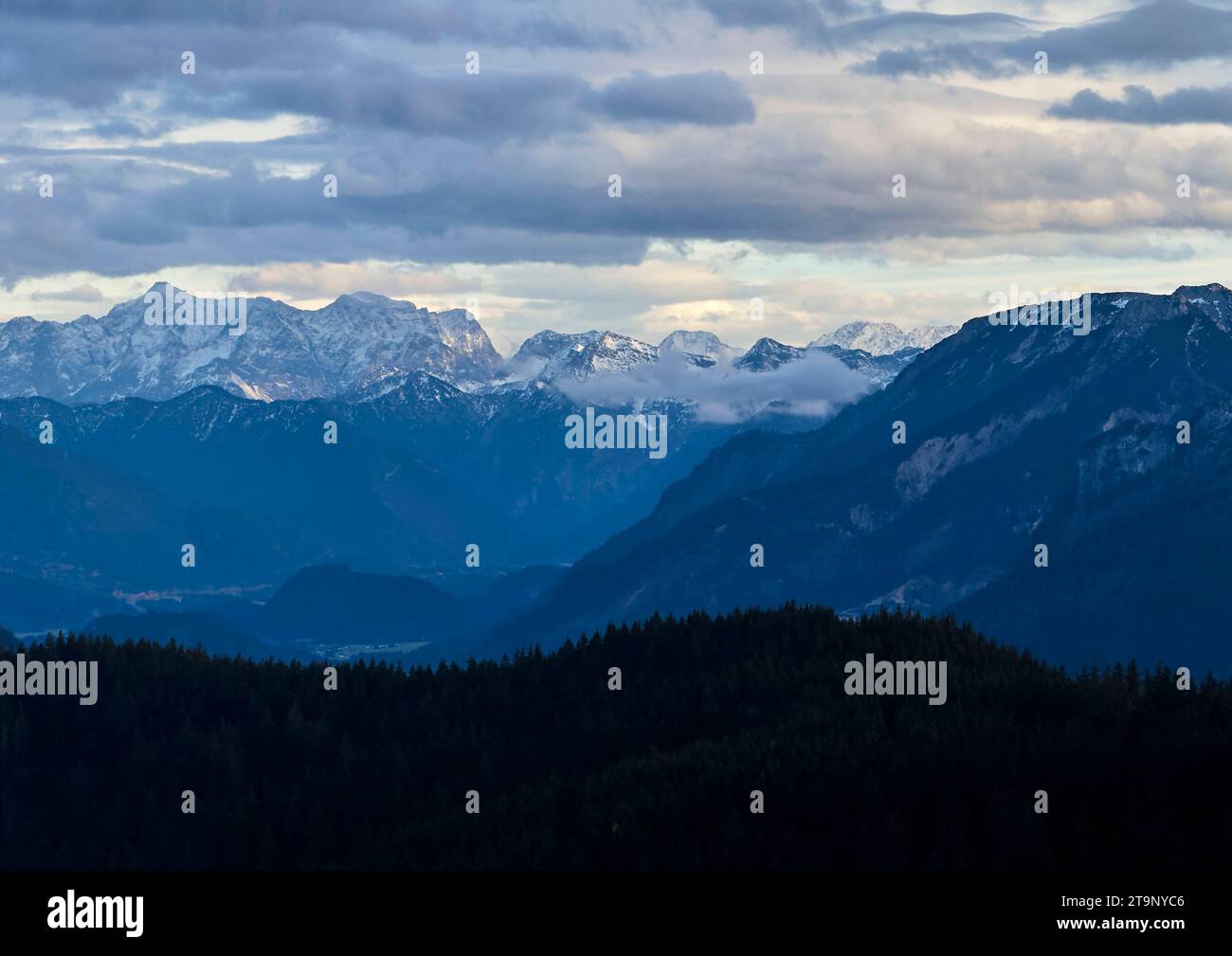 Hiker walking up to Edelsberg peak with Sportheim Böck mountain hut and a view on Zugspitze mountain in Nesselwang, Germany, Nov 20, 2023. Credit: Imago/Alamy Live News Stock Photo