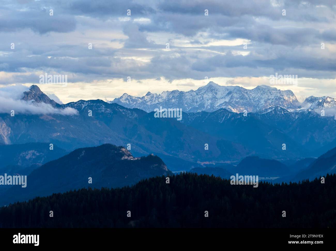 Hiker walking up to Edelsberg peak with Sportheim Böck mountain hut and a view on Falkenstein ruins and Zugspitze mountain in Nesselwang, Germany, Nov 20, 2023. Credit: Imago/Alamy Live News Stock Photo