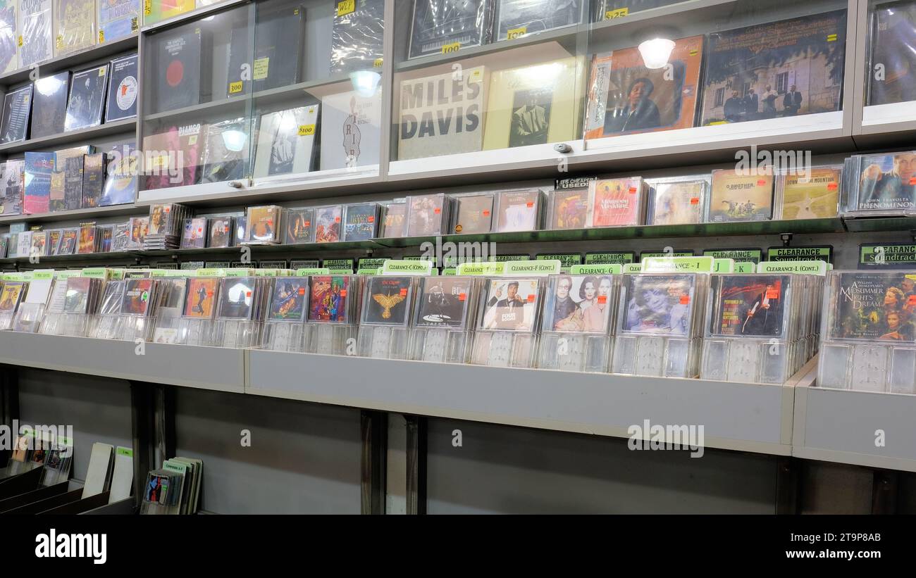 Movie soundtrack used CD clearance section at Amoeba Music in San Francisco, California; wall display showcasing Miles Davis. Stock Photo