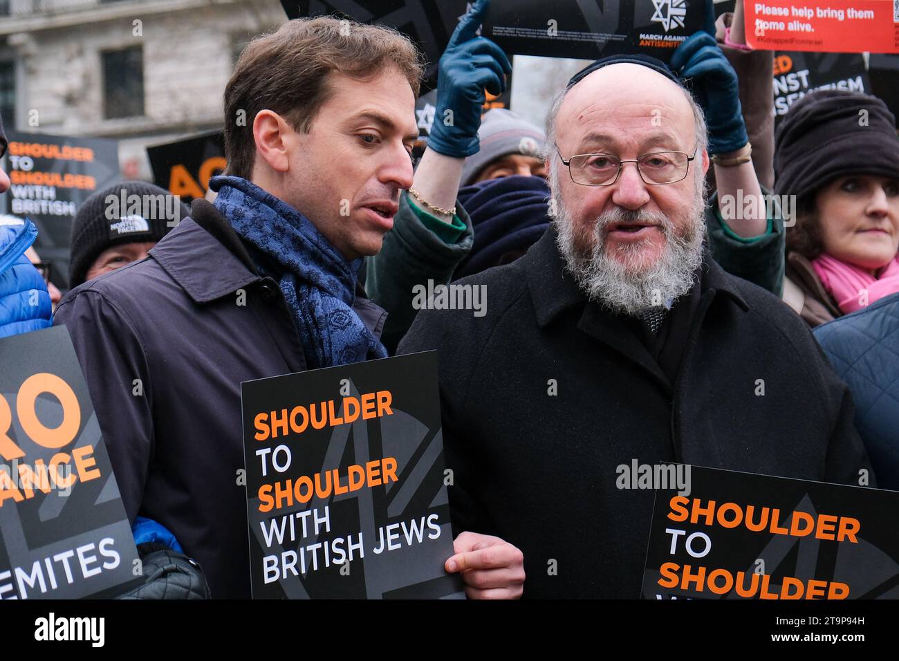London, UK. 26th November, 2023. (L)Campaign Against Antisemitism's Gideon Falter and (R)Chief Rabbi Ephraim Mirvis lead tens of thousands in the March Against Antisemitism in central London, on a route from the Royal Courts of Justice, through to Parliament Square. The rally is said to be the largest of its kind since the Battle of Cable Street in 1936. Credit: Eleventh Hour Photography/Alamy Live News Stock Photo