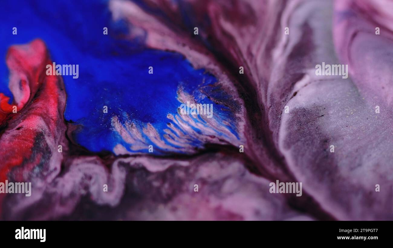 Flow With Ink Paint drip ink flow neon fluid mix blue purple dye Stock Photo - Alamy