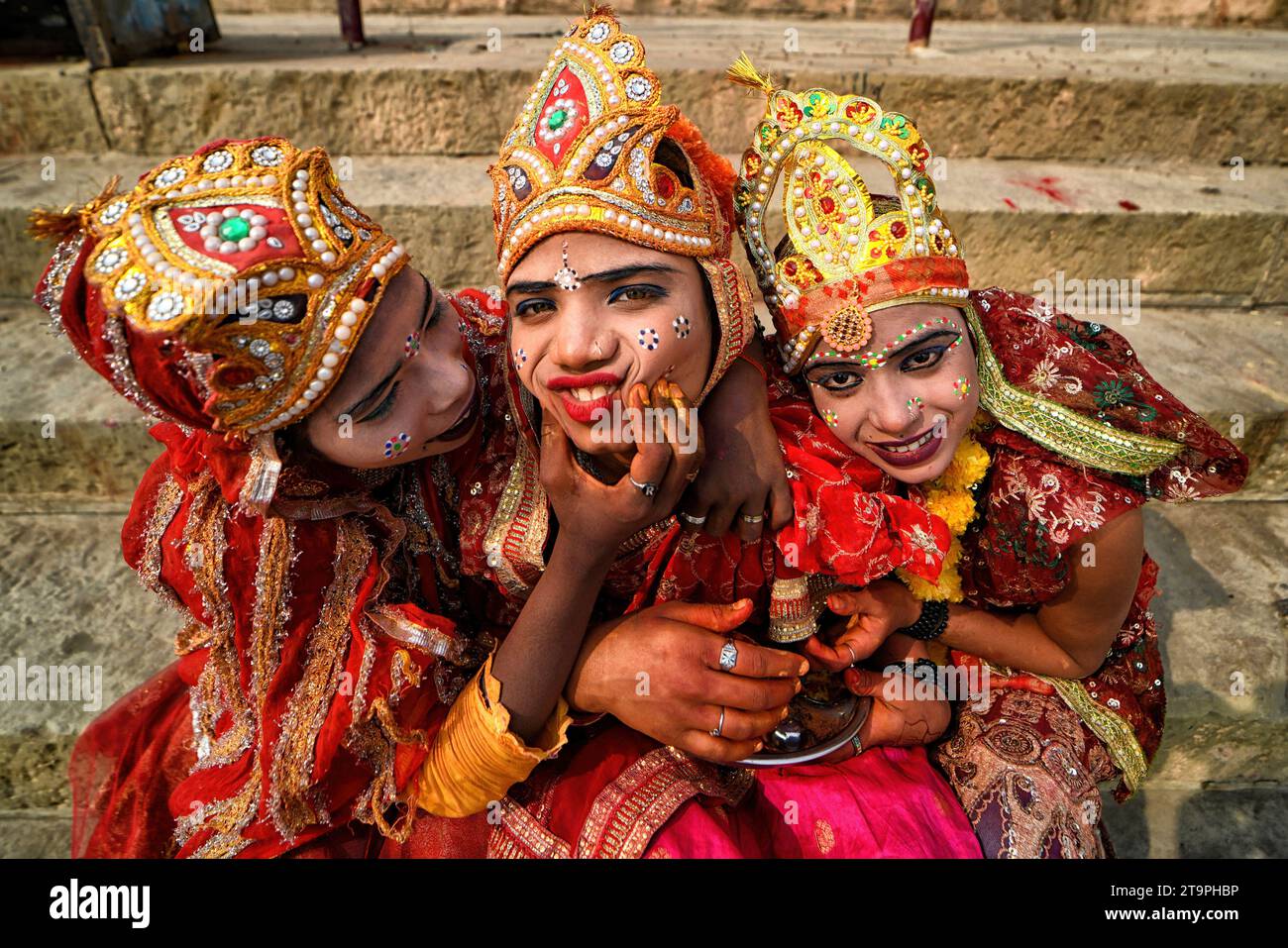 Varanasi, India. 25th Nov, 2023. Little children dressed as Hindu Mythological Characters to collect offerings during the festival. Dev Deepavali/Diwali is the biggest festival of light celebration in Kartik Poornima (Mid-Autumn) where devotees decorate the river bank with millions of lamps during the festival. Credit: SOPA Images Limited/Alamy Live News Stock Photo