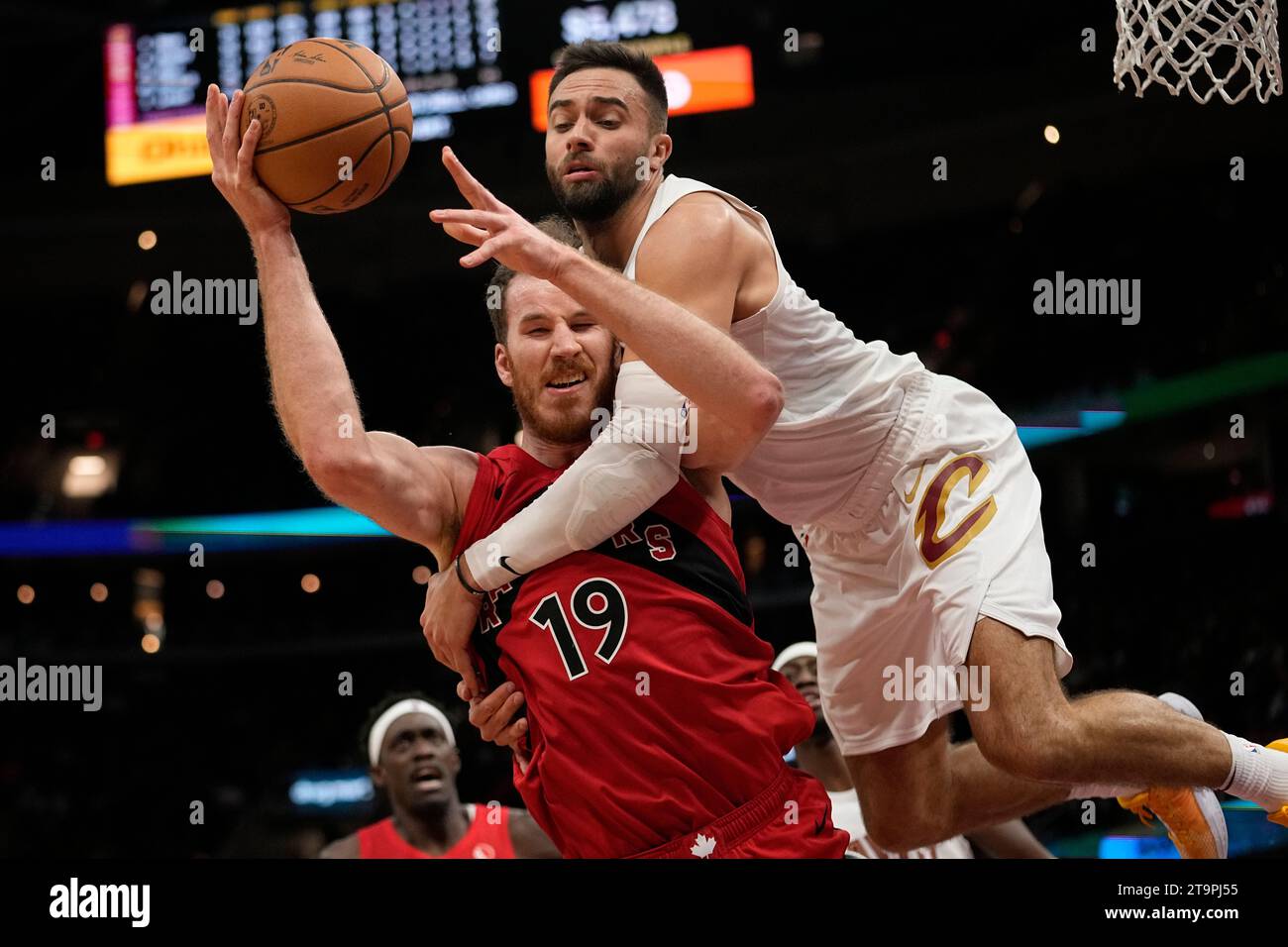 Toronto Raptors center Jakob Poeltl (19) is fouled by Cleveland ...
