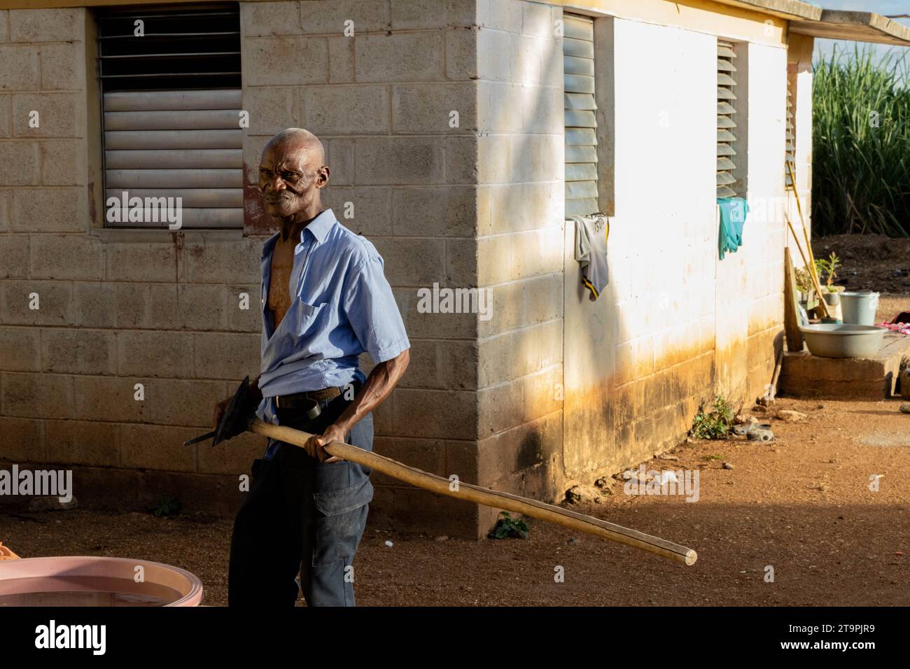 A man sharpens a plow in a Central Romana batey, or community, in El Seibo, Dominican Republic on Nov. 21, 2023. Bateyes are home to sugar cane workers and their families. Most residents of these communities are either undocumented Haitian immigrants or denationalized Dominicans of Haitian descent. The United States blocked the Central Romana Corporation, Ltd. from importing sugar into the country on Nov. 23, 2022 after allegations of forced labor were levied against the company. (Photo by Carlos Berríos Polanco/Sipa USA) Stock Photo