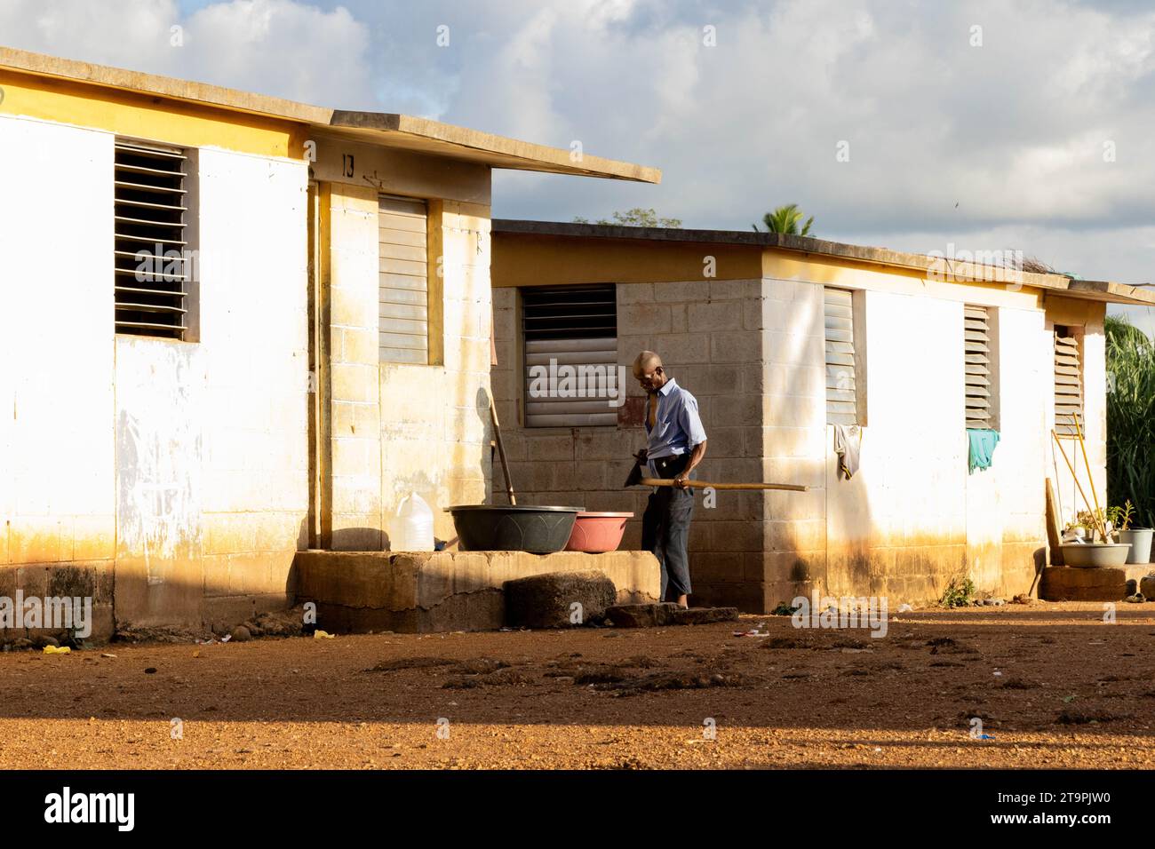 A man sharpens a plow in a Central Romana batey, or community, in El Seibo, Dominican Republic on Nov. 21, 2023. Bateyes are home to sugar cane workers and their families. Most residents of these communities are either undocumented Haitian immigrants or denationalized Dominicans of Haitian descent. The United States blocked the Central Romana Corporation, Ltd. from importing sugar into the country on Nov. 23, 2022 after allegations of forced labor were levied against the company. (Photo by Carlos Berríos Polanco/Sipa USA) Stock Photo