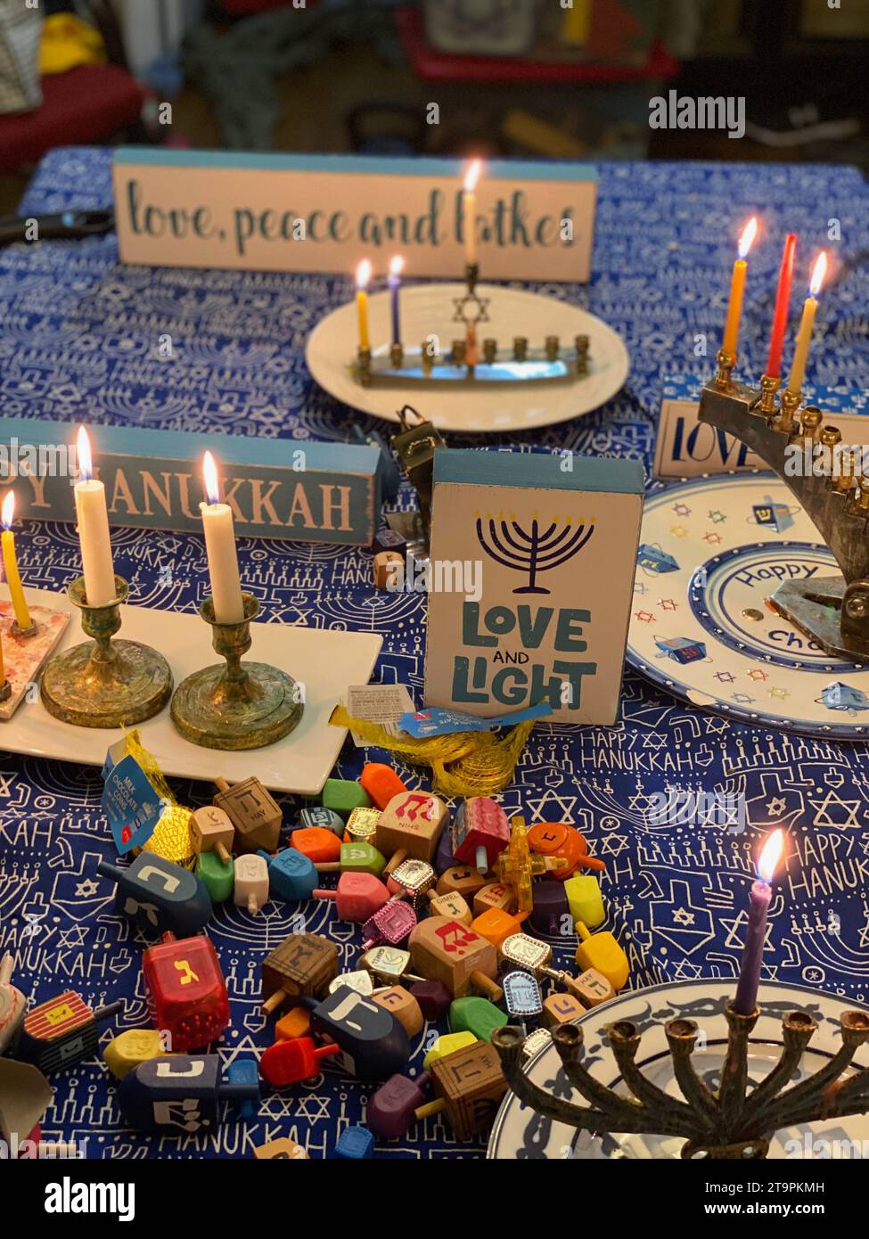 USA. 11th Dec, 2020. Love and Light. Hanukkah, the 2nd night plus the shamash (the helper) candle on the menorah. Draidels and chocolate coins are part of the festivities. Photo credit: Robyn Stevens Brody/Sipa USA. Credit: Sipa USA/Alamy Live News Stock Photo