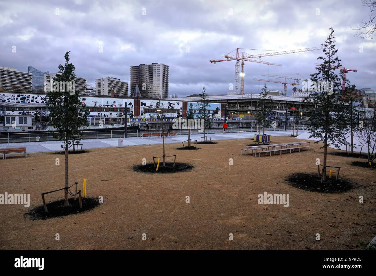 Wide angle shot of the renovation work in the Brussels havenlaan area, with large graffitic painting in the background of he canal Stock Photo