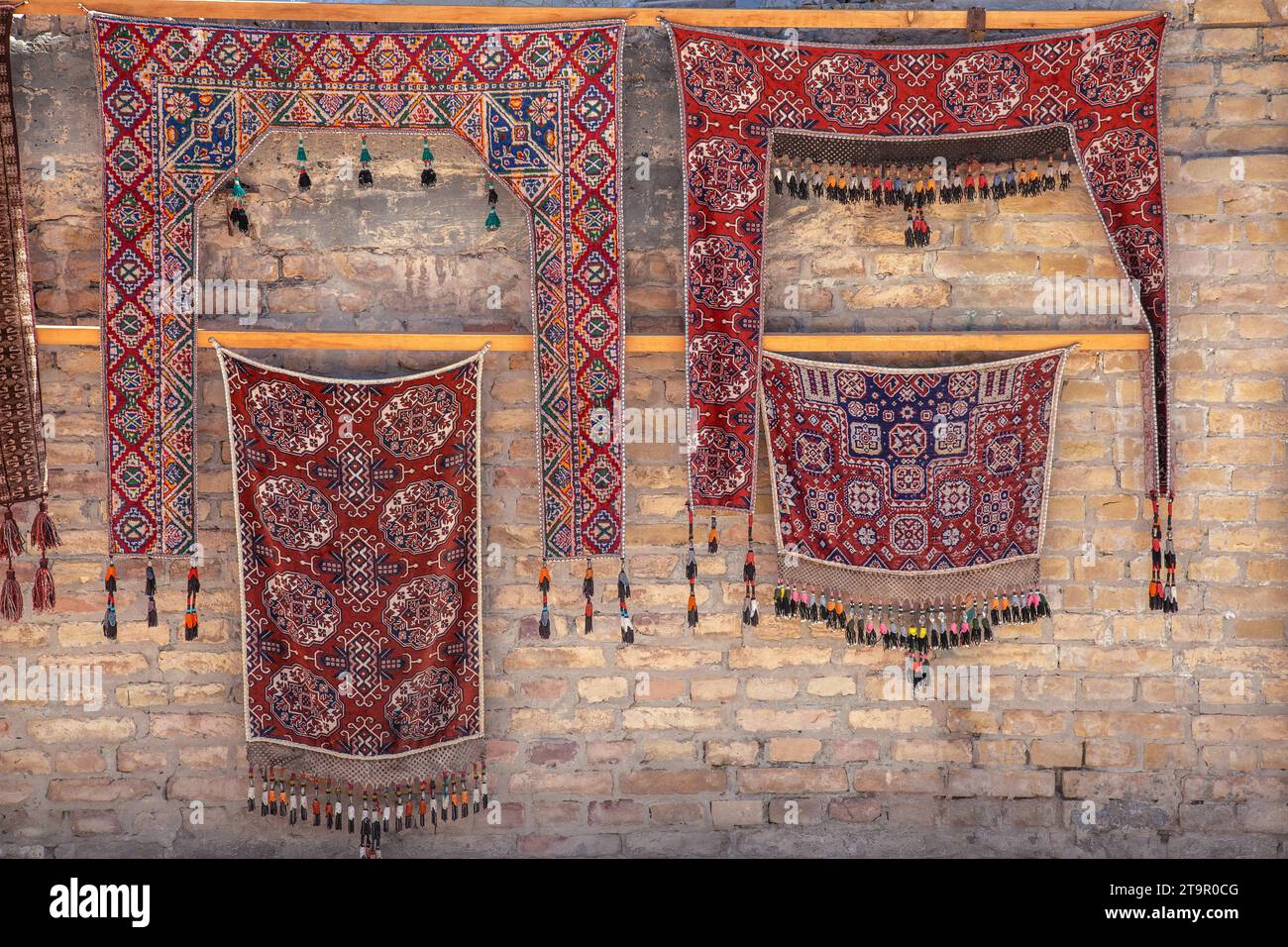Traditional Uzbek carpets on the wall in a gift shop Stock Photo Alamy