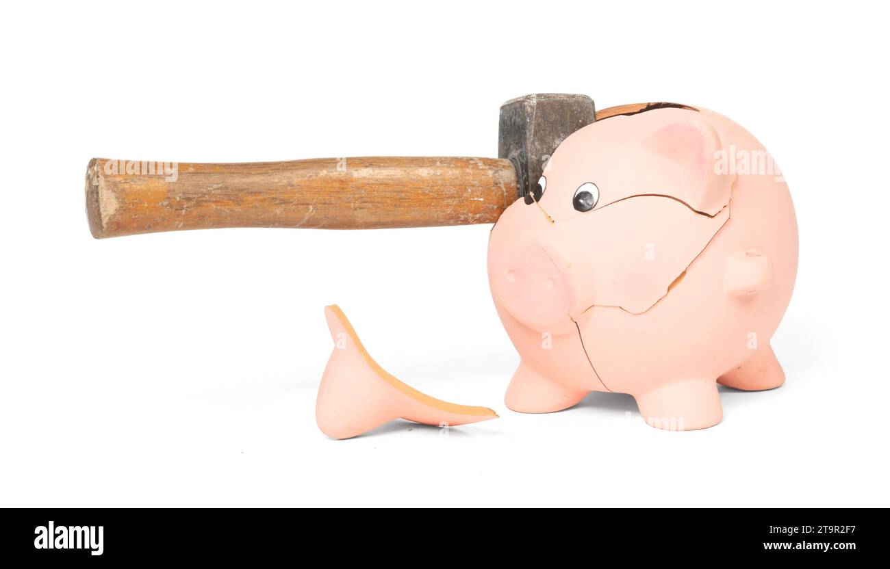 Hammer breaking piggy bank isolated on white Stock Photo - Alamy