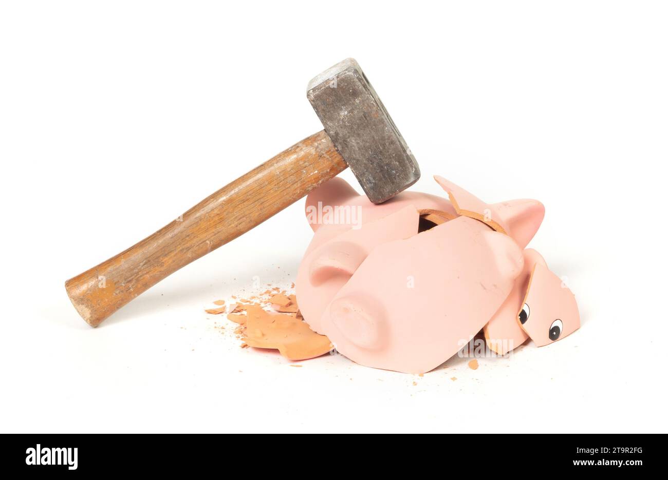 Hammer breaking piggy bank isolated on white Stock Photo - Alamy