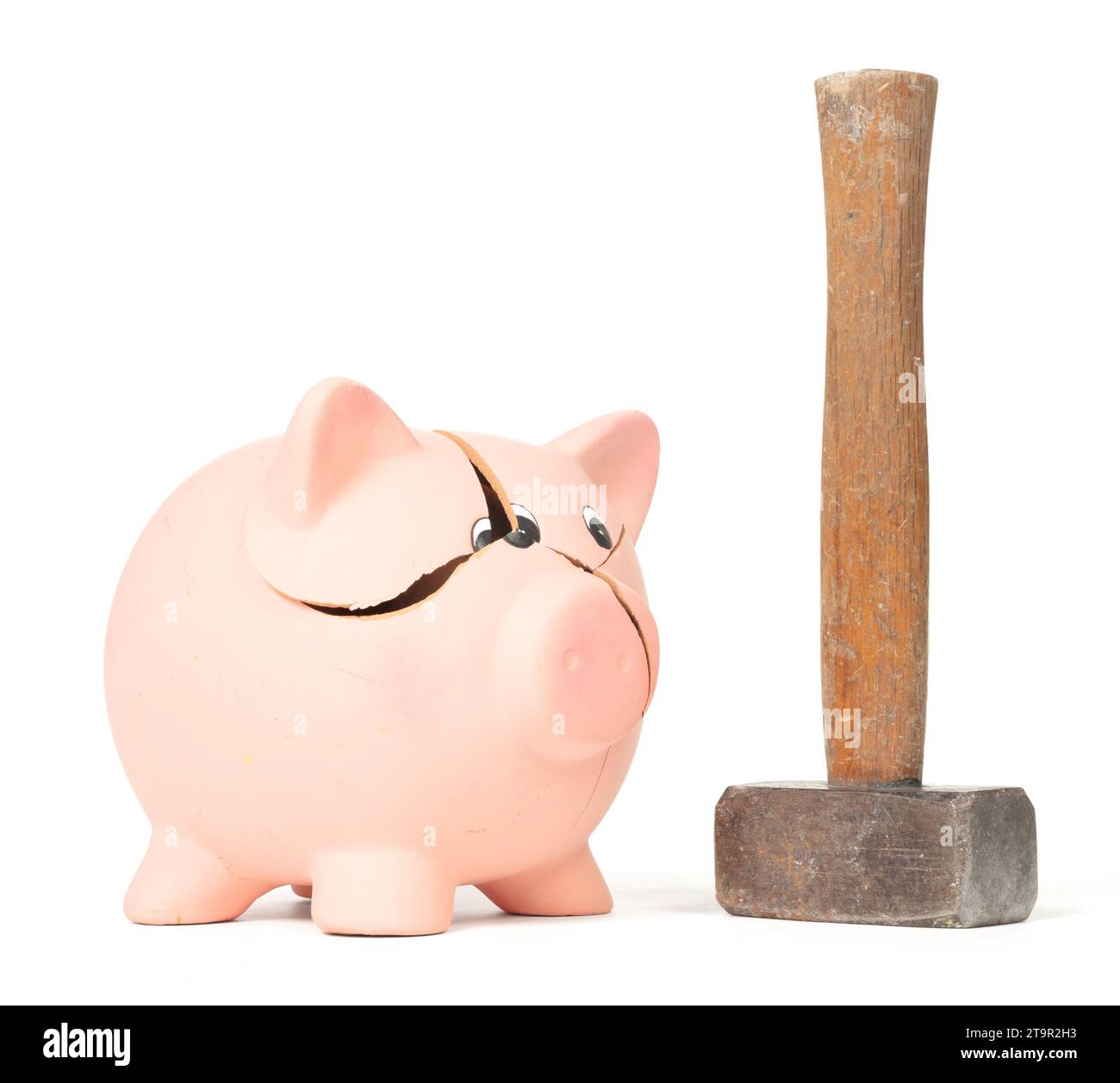 Hammer breaking piggy bank isolated on white Stock Photo - Alamy