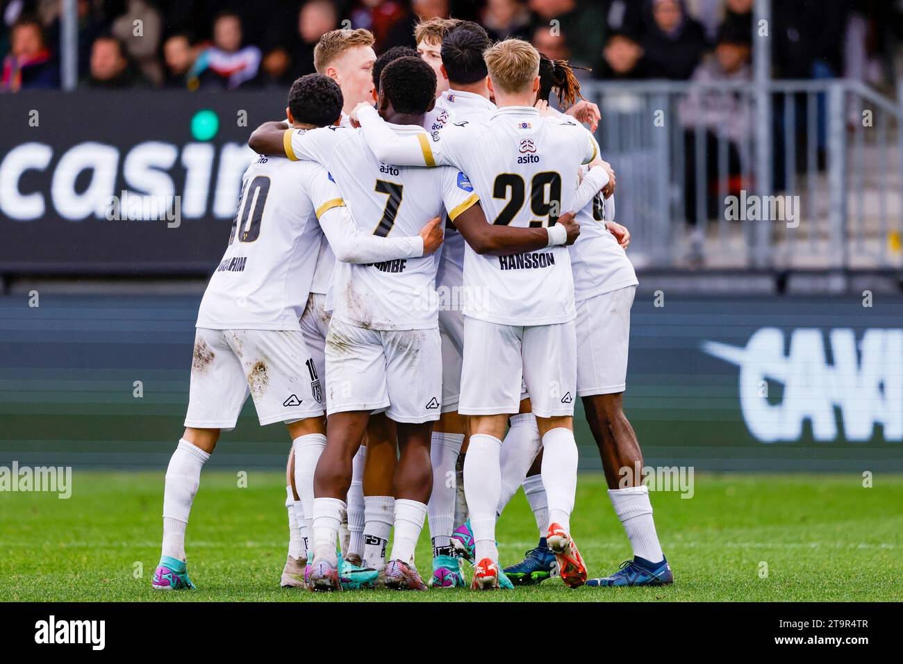 ALMERE, NETHERLANDS - NOVEMBER 26: Mohamed Sankoh (Heracles Almelo) scores the 0-2 celebrating his goal with teammates during the Eredivisie match of Stock Photo