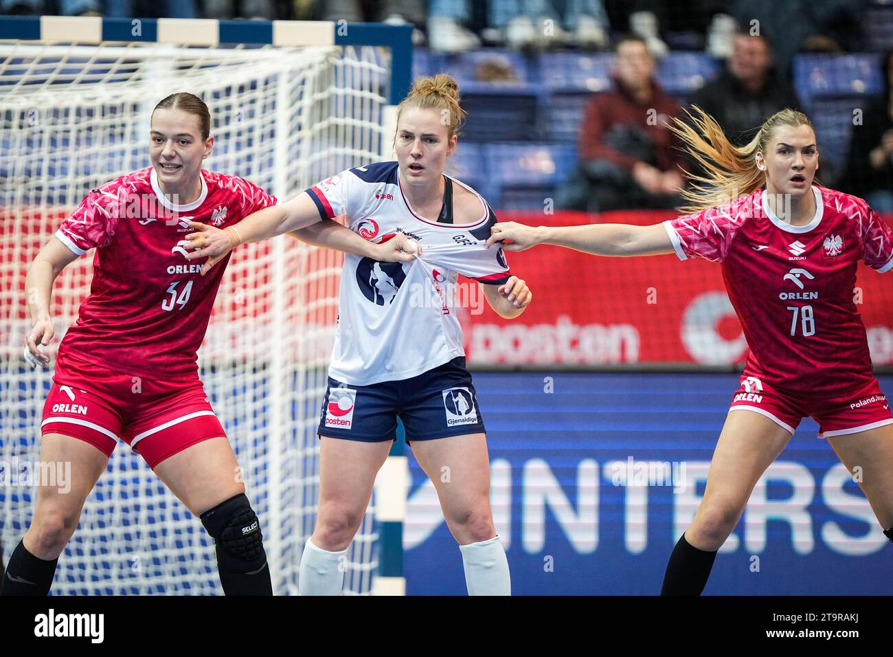 Lillehammer 20231126.Poland's Marlena Urbanska, Norway's Vilde Mortensen Ingstad and Poland's Paulina Uscinowicz during the international match between Norway and Poland in Haakons Hall, before the woman's handball World Championship in Norway, Sweden and Denmark. Photo: Beate Oma Dahle / NTB Stock Photo