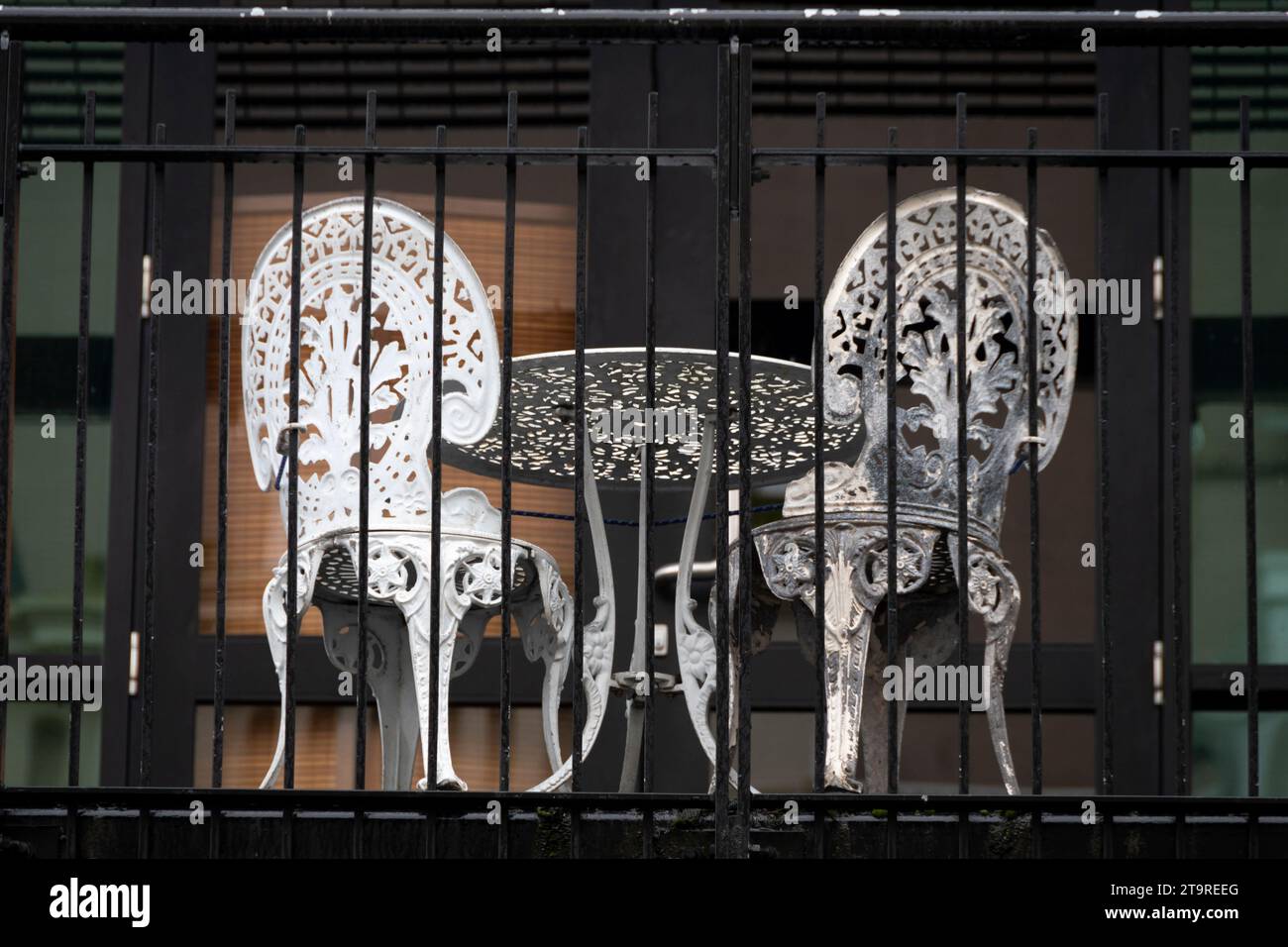 Table and chairs on balcony over city street, Wellington, North Island