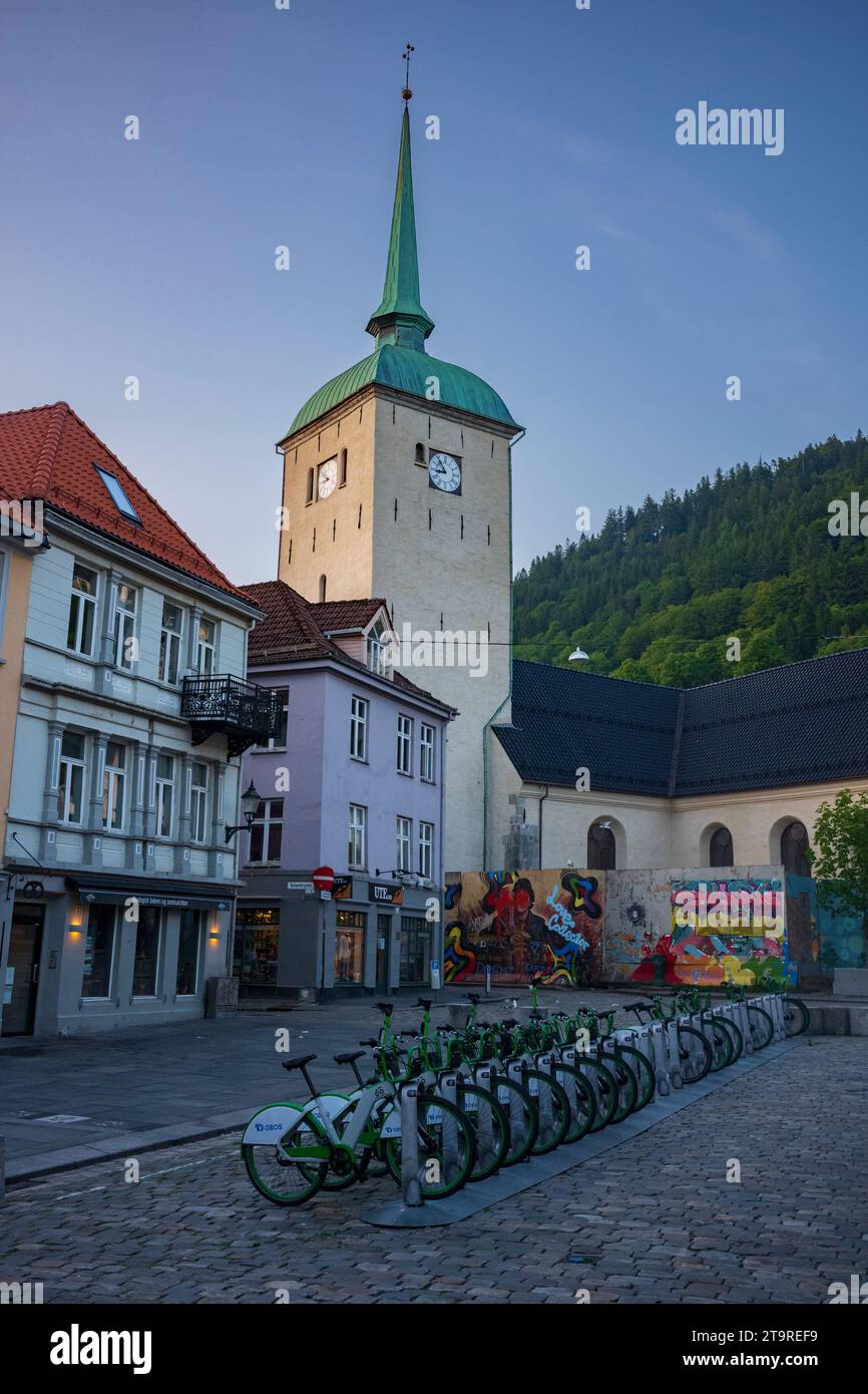 Bergen, Norway, June 23, 2023:  Bergen Cathedral, shown here at sunset on an empty cobblestone street, is the episcopal seat of the Diocese of Bjørgvi Stock Photo
