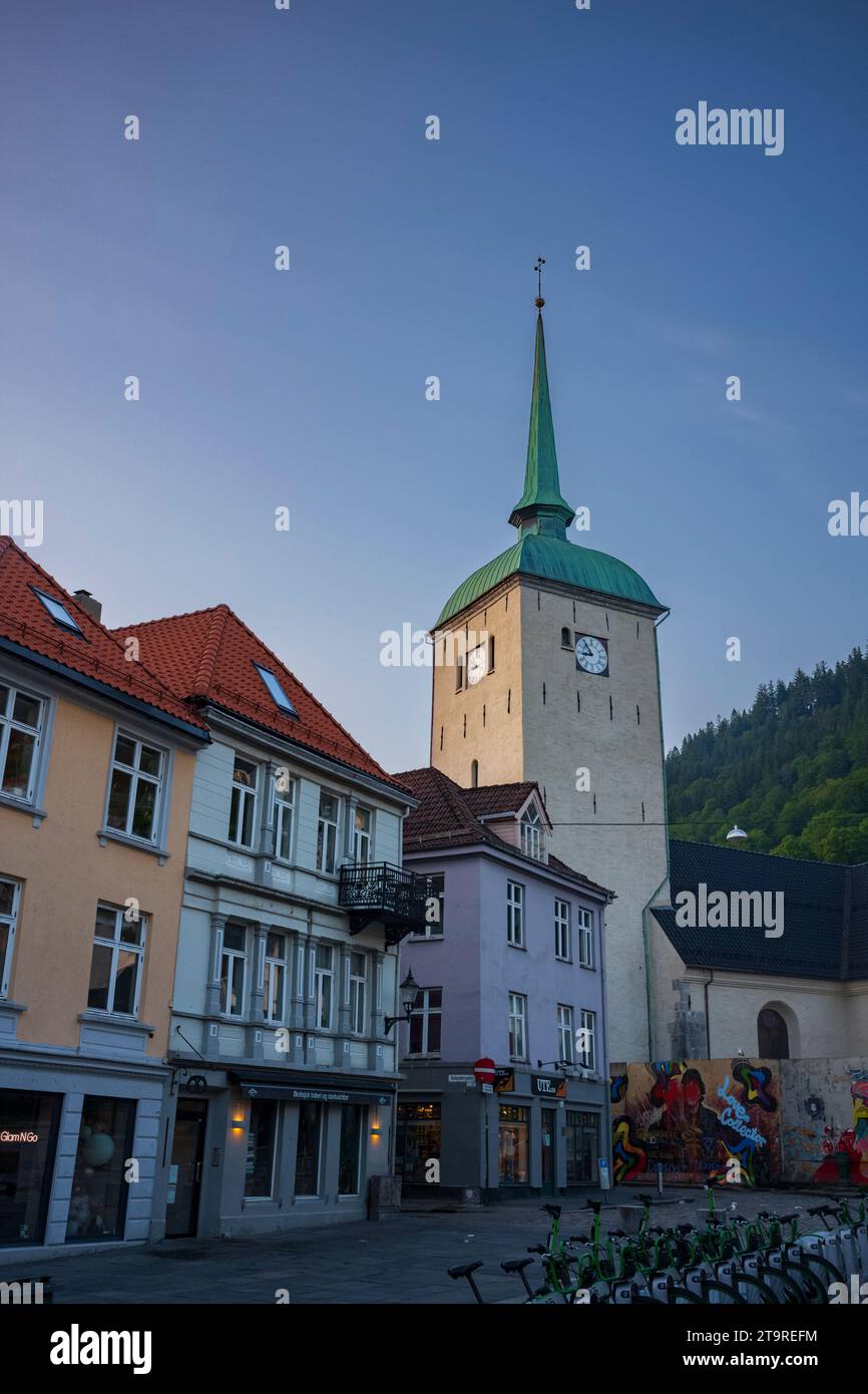 Bergen, Norway, June 23, 2023:  Bergen Cathedral, shown here at sunset on an empty cobblestone street, is the episcopal seat of the Diocese of Bjørgvi Stock Photo
