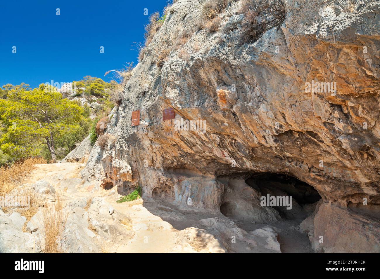 The entrance to the famous Cave of Euripides, where the ancient tragedian poet used to spend much time, in the island of Salamina, near Athens, Greece Stock Photo