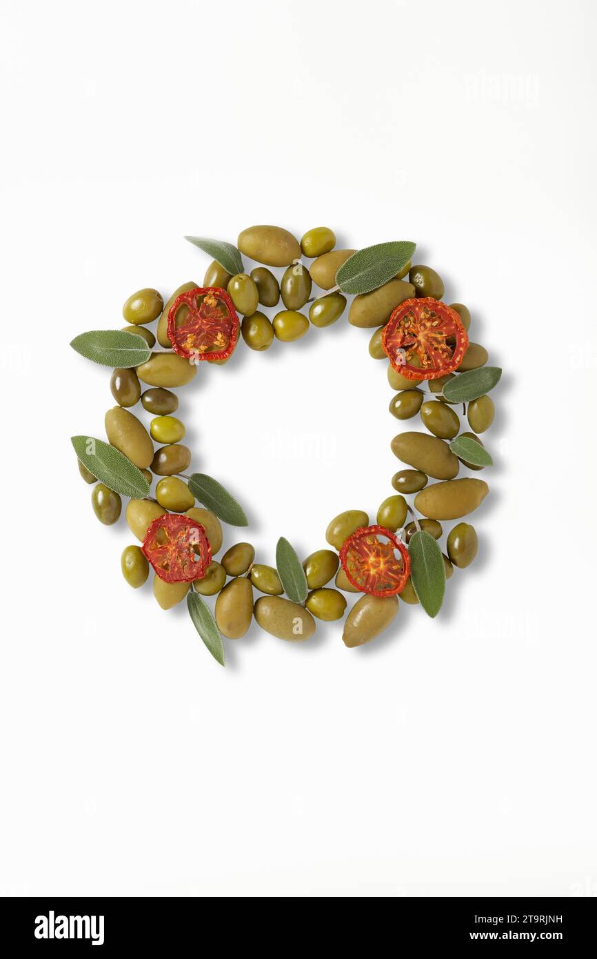Olives and sage made to look like a wreath Stock Photo Alamy