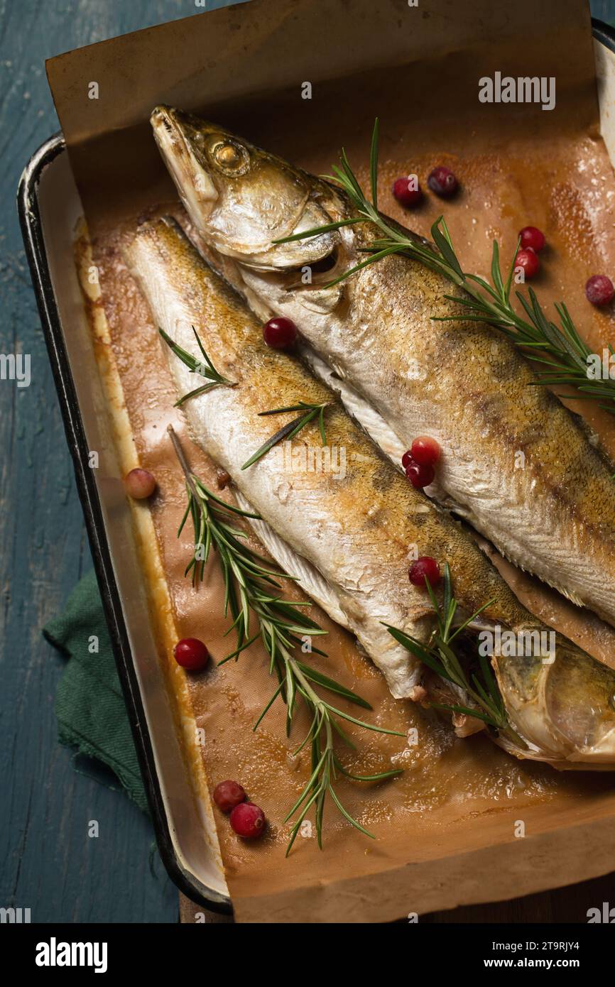 Baked pikes with rosemary and cranberries, a light Christmas meal, an ...