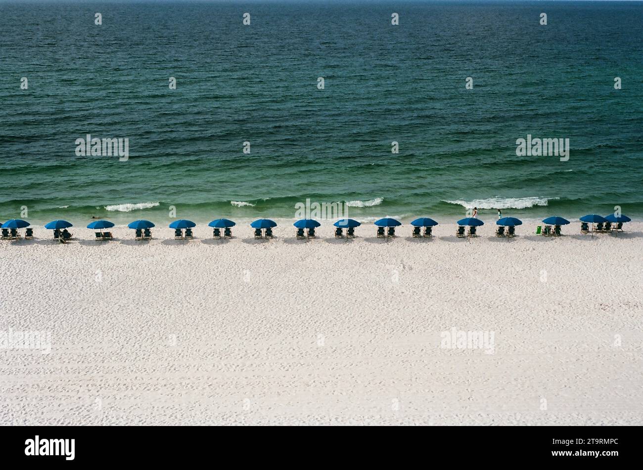 Beach Umbrellas lines up on the beach Stock Photo