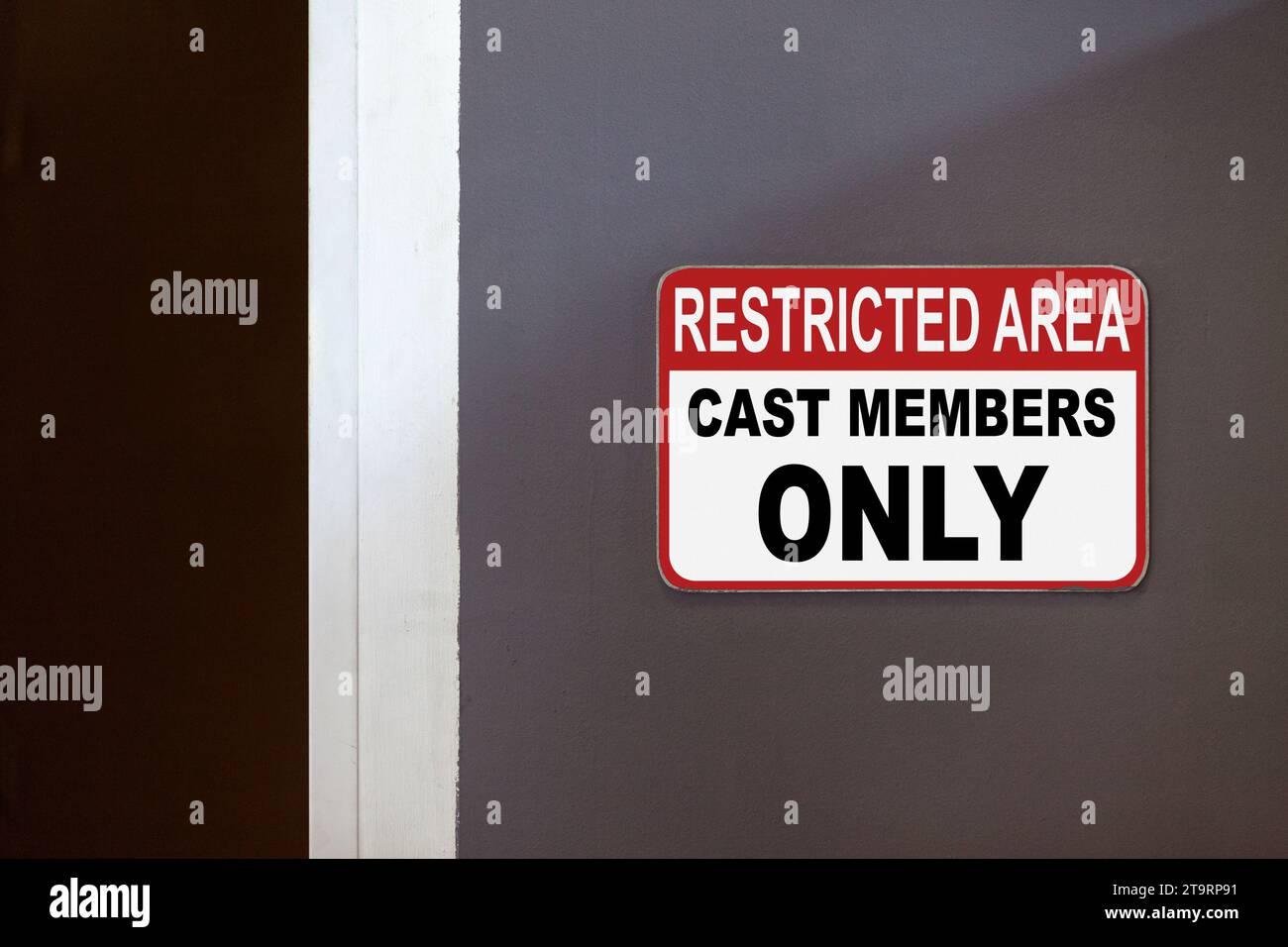 Cast Member Sign Red and white restricted area sign on the side of an open door stating ...