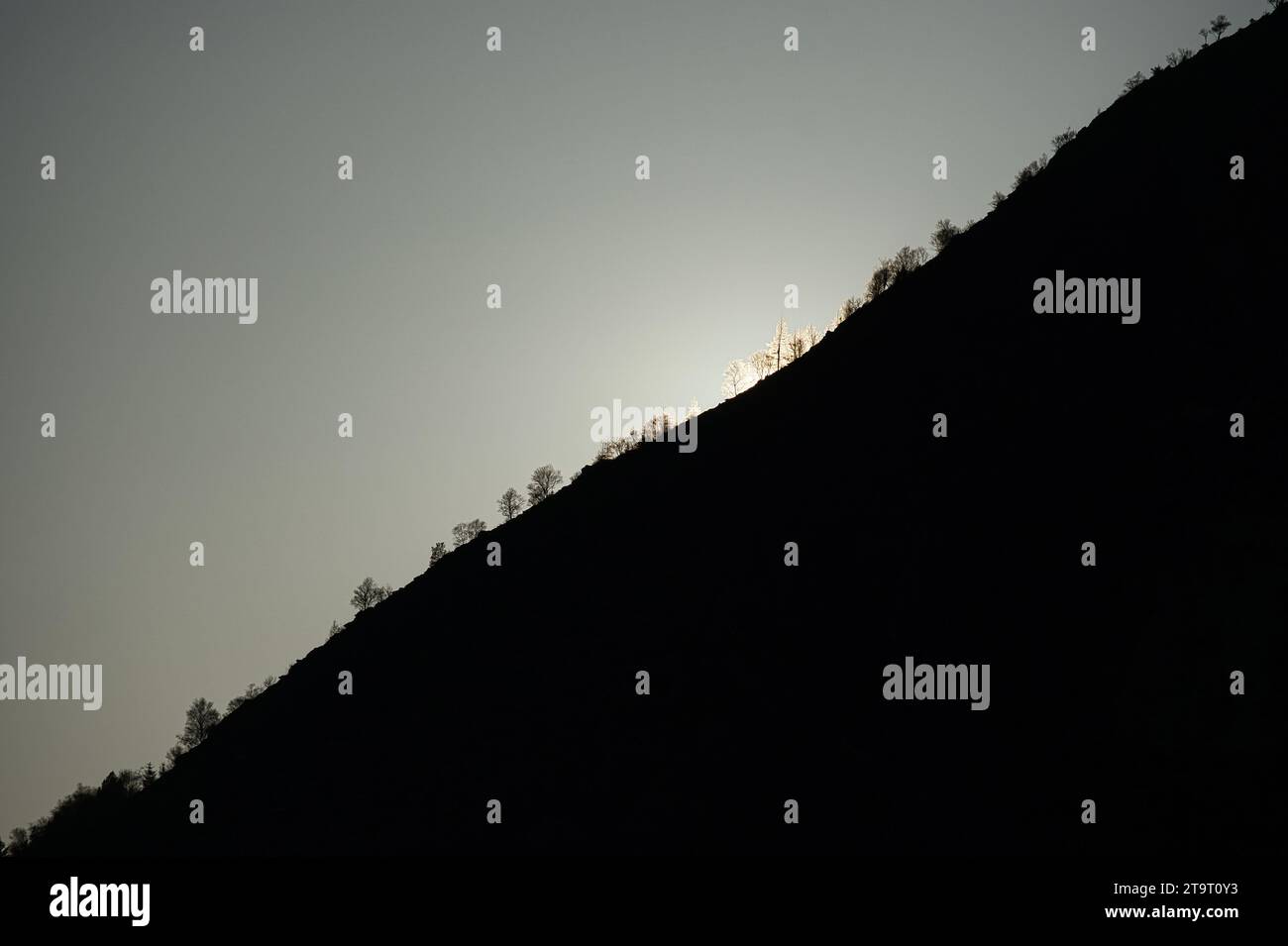 Sunrise on a mountain peak in Norway. The mountain in the shade. Landscape shot from Scandinavia Stock Photo
