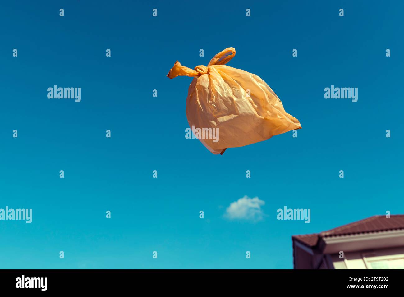 Used plastic bags floating in the air and sky, garbage and pollution, global warming and climate change. Stock Photo