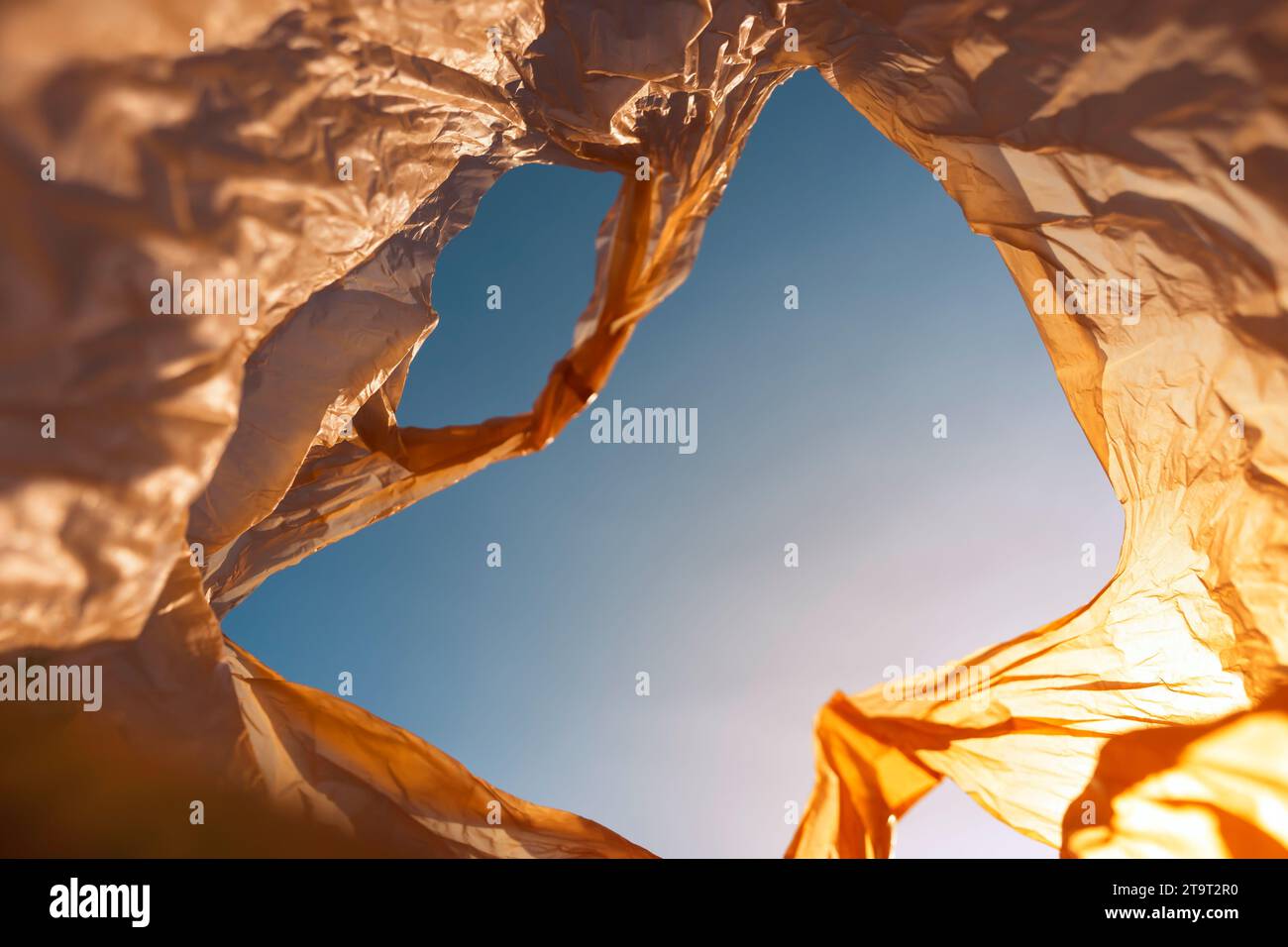 Inside of used plastic bags floating in the air and sky, garbage and pollution, global warming and climate change. Stock Photo