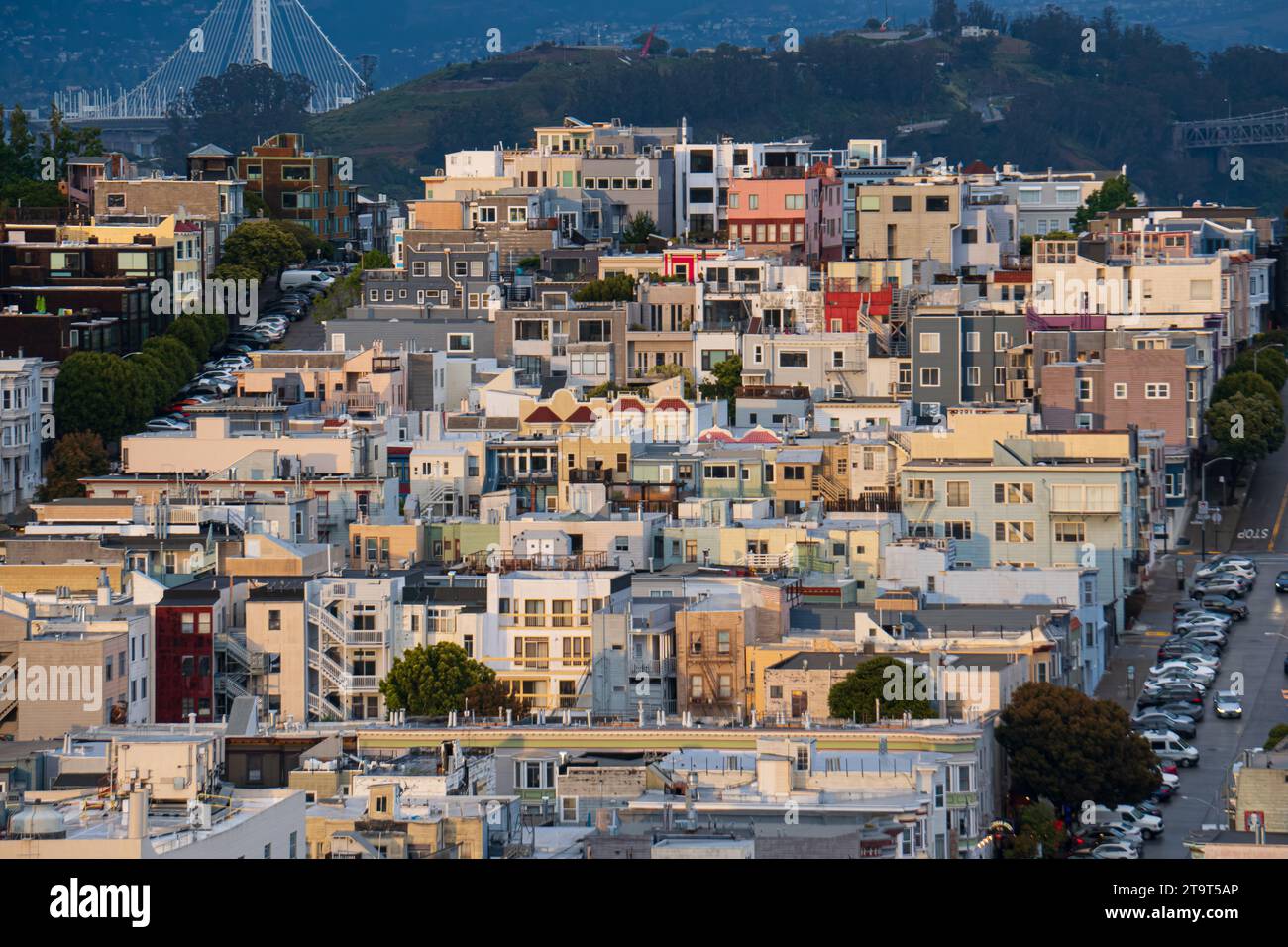 Residential area of San Francisco, California, sprawling up a hill, after a rain storm and at dusk. Stock Photo