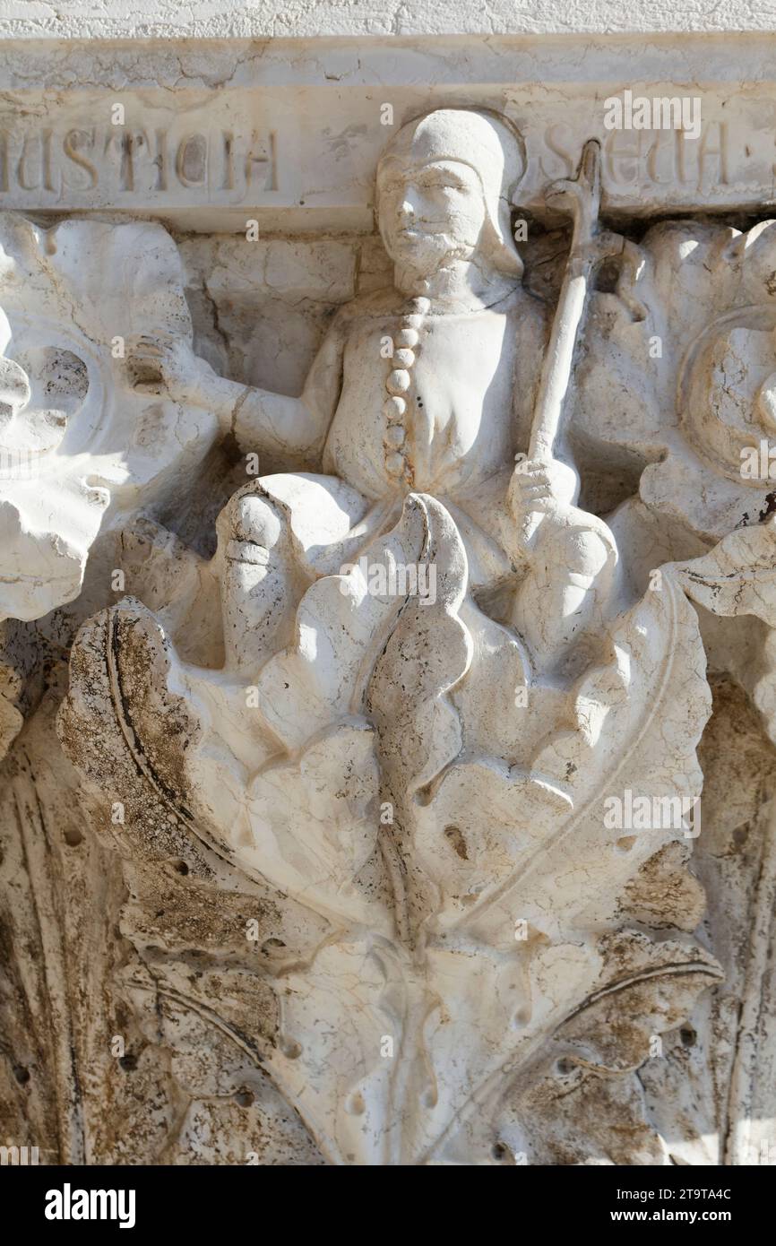 Injustice - Virtues and vices - Column capital of Palazzo Ducale (Doge's Palace, St Mark's Square) - Venice Stock Photo