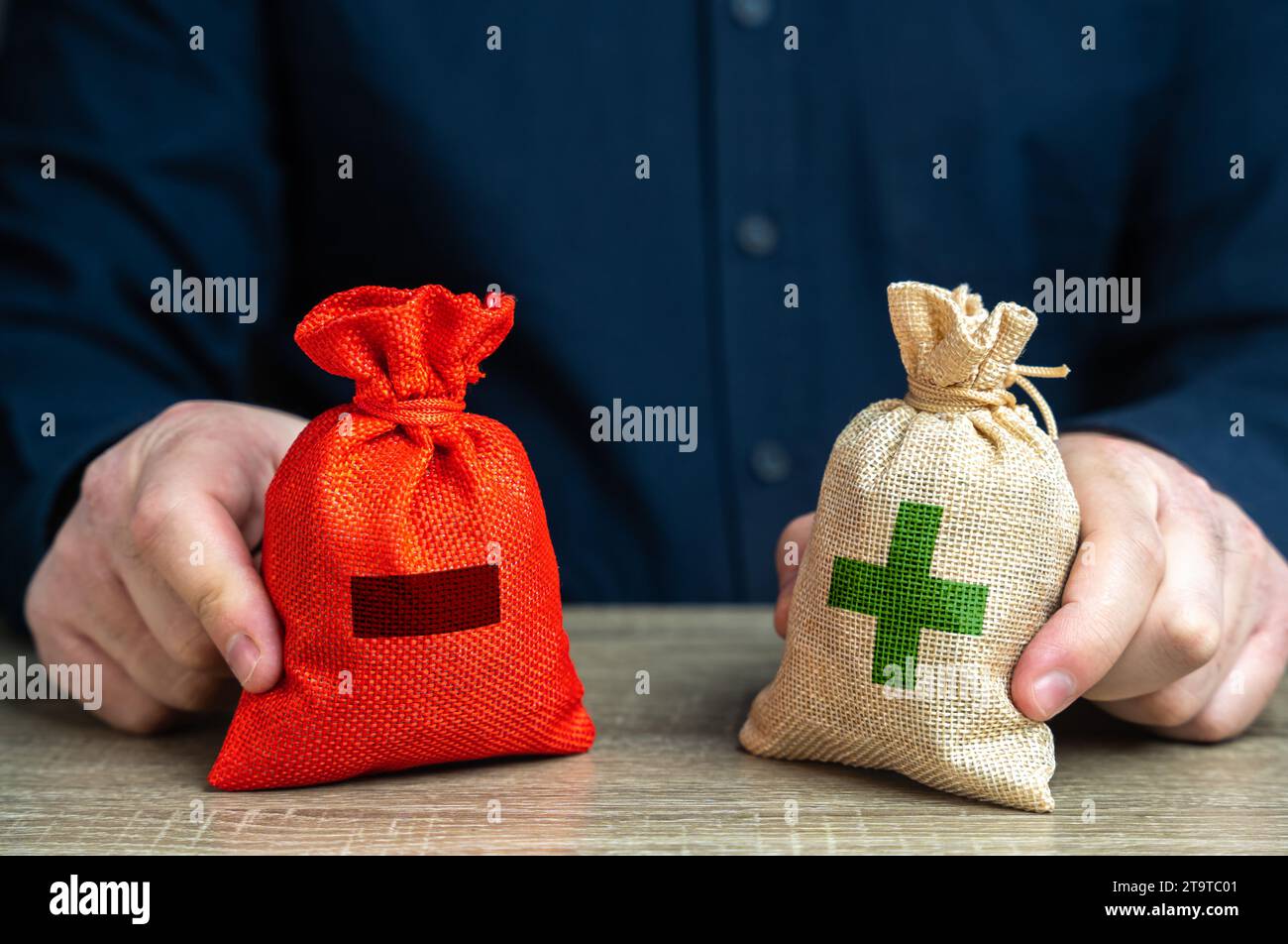 Pros and cons in to bags to compare. Risk planning. Advantages and disadvantages. Evaluating profit and losses. Make a choice despite on benefits and Stock Photo