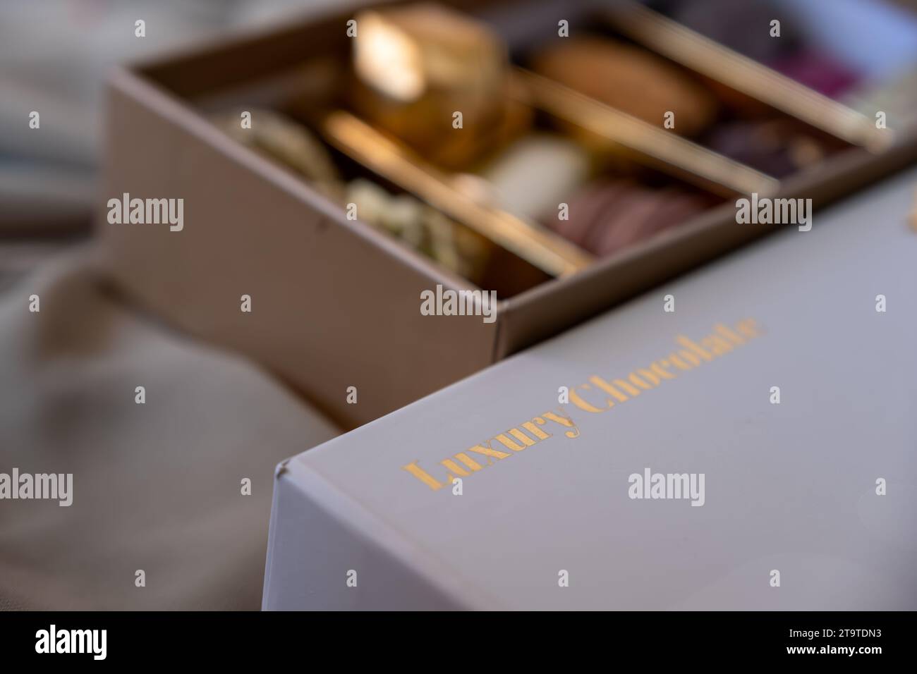 Chocolate box with golden words luxury chocolate with mock up space and ...