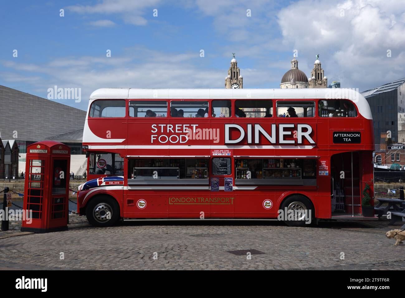 British Symbols of Red Double-Decker Bus, Converted to Street Food Diner, and Red K6 Telephone Box England UK Stock Photo