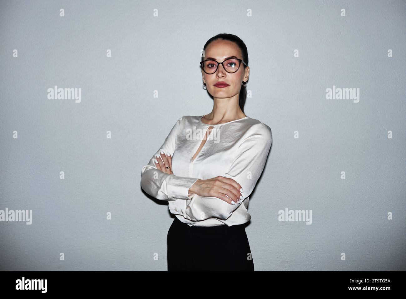 Woman cross arms stand hi-res stock photography and images - Alamy