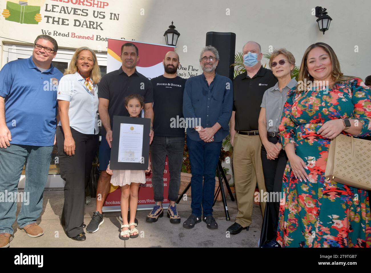 CORAL GABLES, FLORIDA - NOVEMBER 25: Coral Gables Commissioner Alex Fernandez, Althea Harris of the Small Business Administration, Coral Gables Mayor Vince Lago and daughter, Books & Books' Jonah Kaplan and Mitchell Kaplan, Coral Gables Chamber of Commerce President Mark Trowbridge, Coral Gables Commissioner Rhonda Anderson and Gables Chamber of Commerce Chair Sara M. Hernandez attend the celebrated and launch of Books & Books Literary new nonprofit Foundation with the Coral Gables business and literary community and the Coral Gables Chamber of Commerce Small Business Saturday at Books and Boo Stock Photo