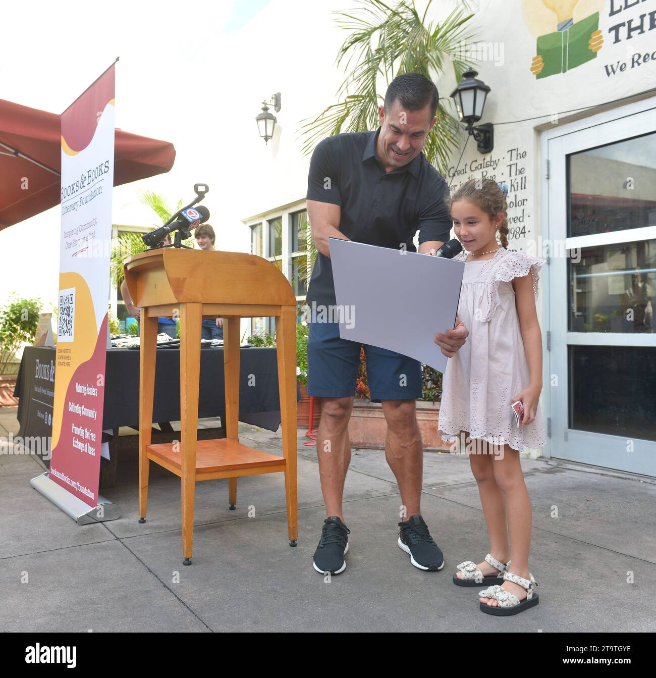 Coral Gables, USA. 25th Nov, 2023. CORAL GABLES, FLORIDA - NOVEMBER 25: Coral Gables Mayor Vince Lago and daughter attends the celebrated and launch of Books & Books Literary new nonprofit Foundation with the Coral Gables business and literary community and the Coral Gables Chamber of Commerce Small Business Saturday at Books and Books-Gables on November 25, 2023 in Coral Gables, Florida. (Photo by JL/Sipa USA) Credit: Sipa USA/Alamy Live News Stock Photo