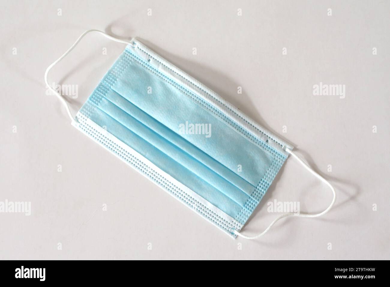 A Medical face mask on a white background Stock Photo - Alamy